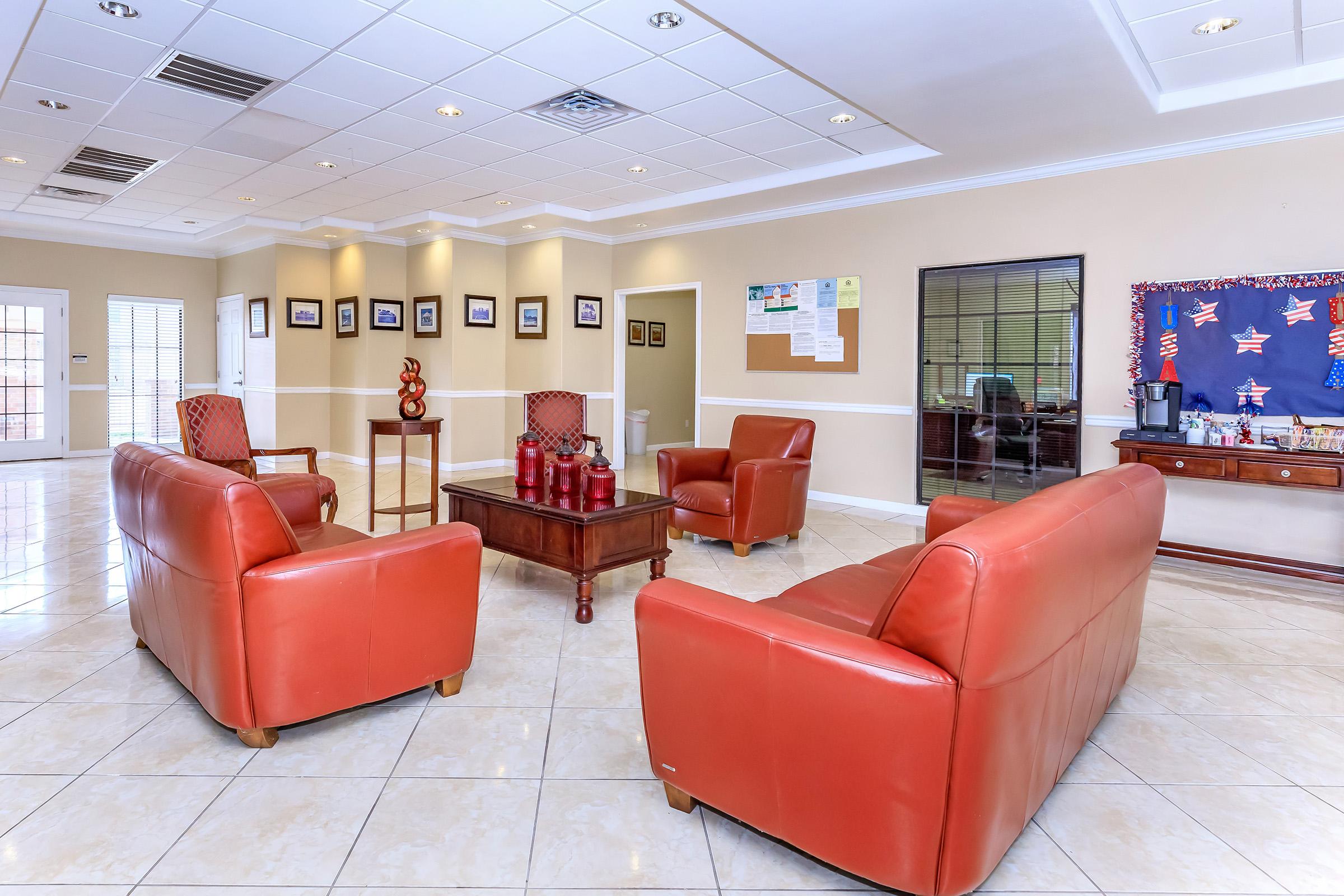 a living room filled with furniture and a flat screen tv