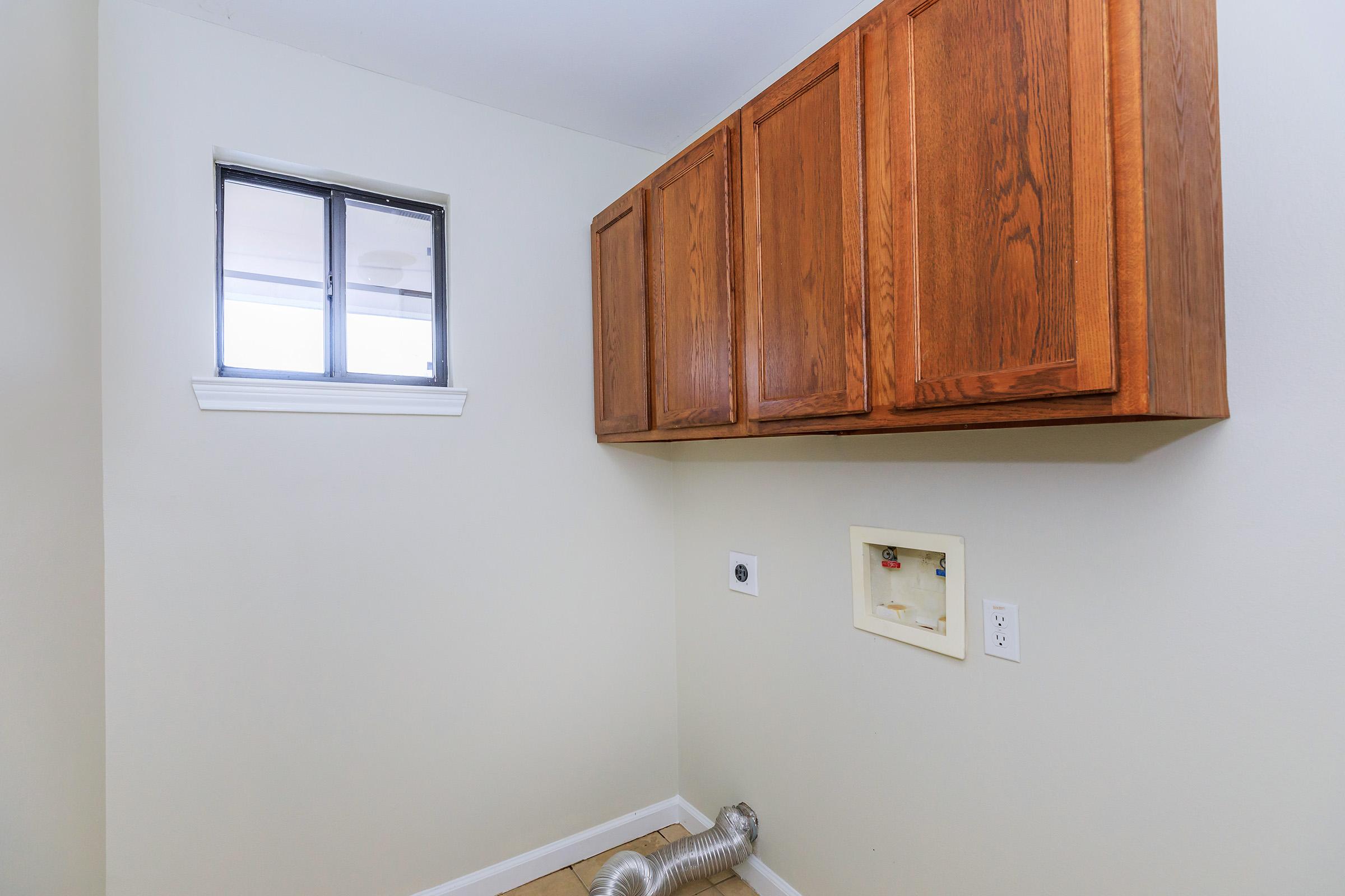 a kitchen with a sink and a window