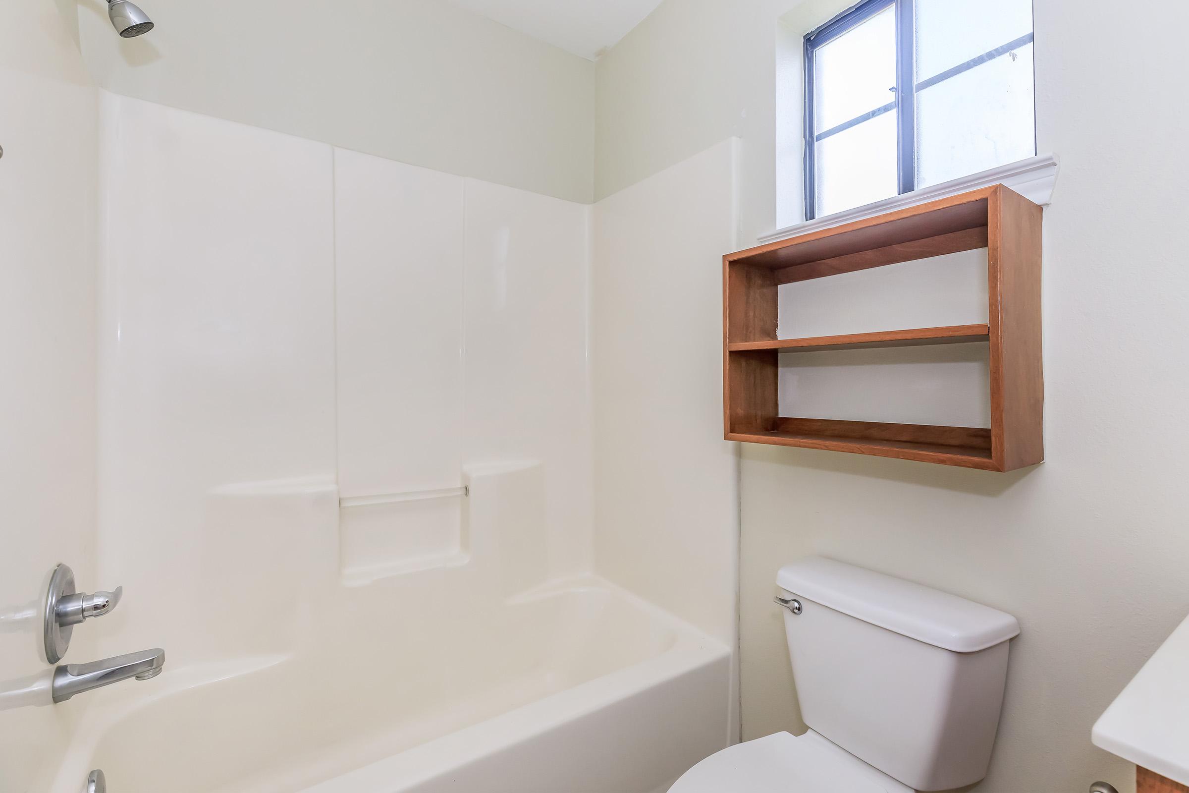 a room with a sink and a bath tub