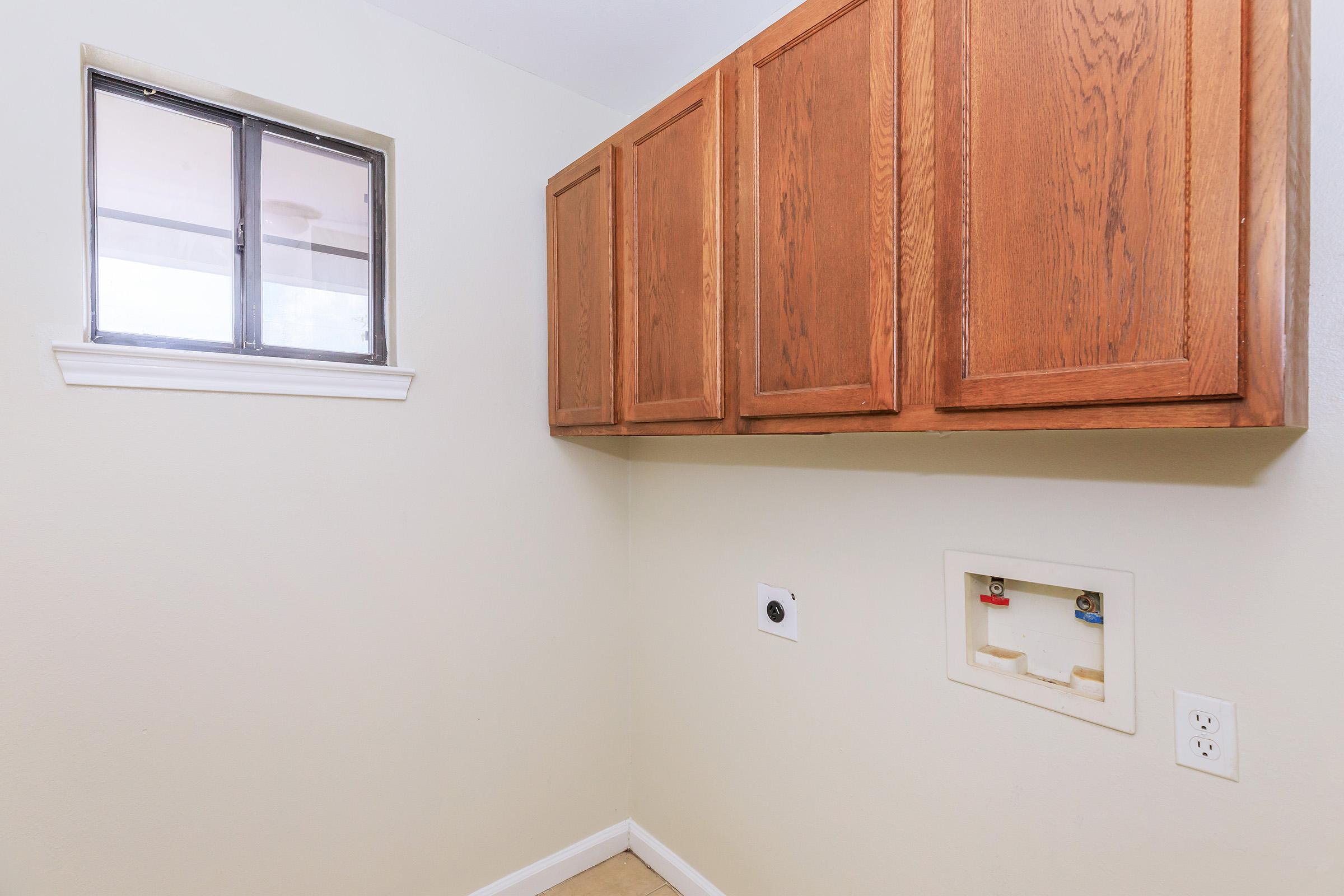 a kitchen with a sink and a window