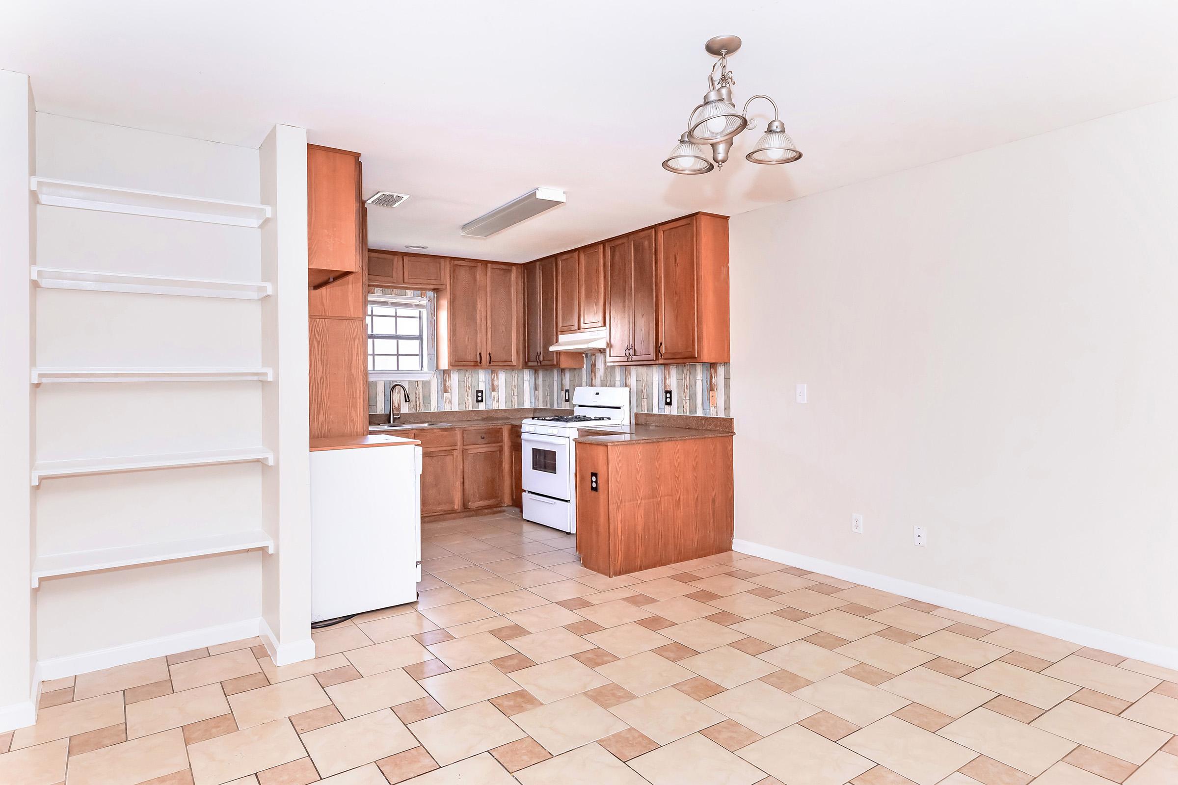 a kitchen with a building in the background