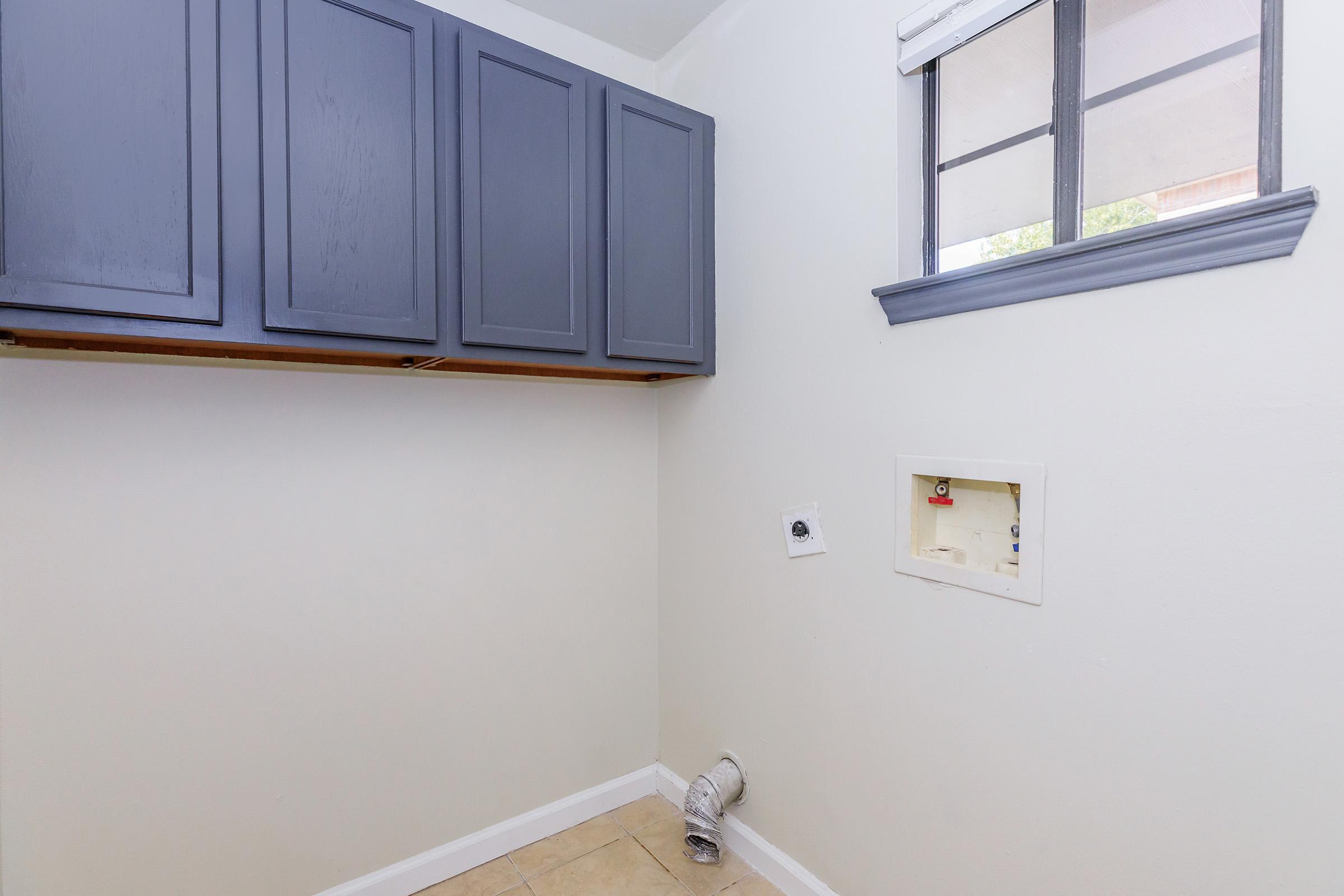 a kitchen with a sink and a window