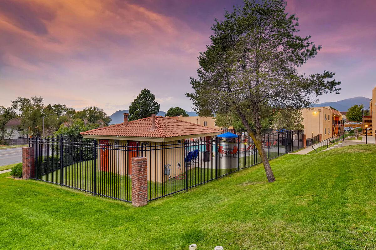 a small house in a grassy yard