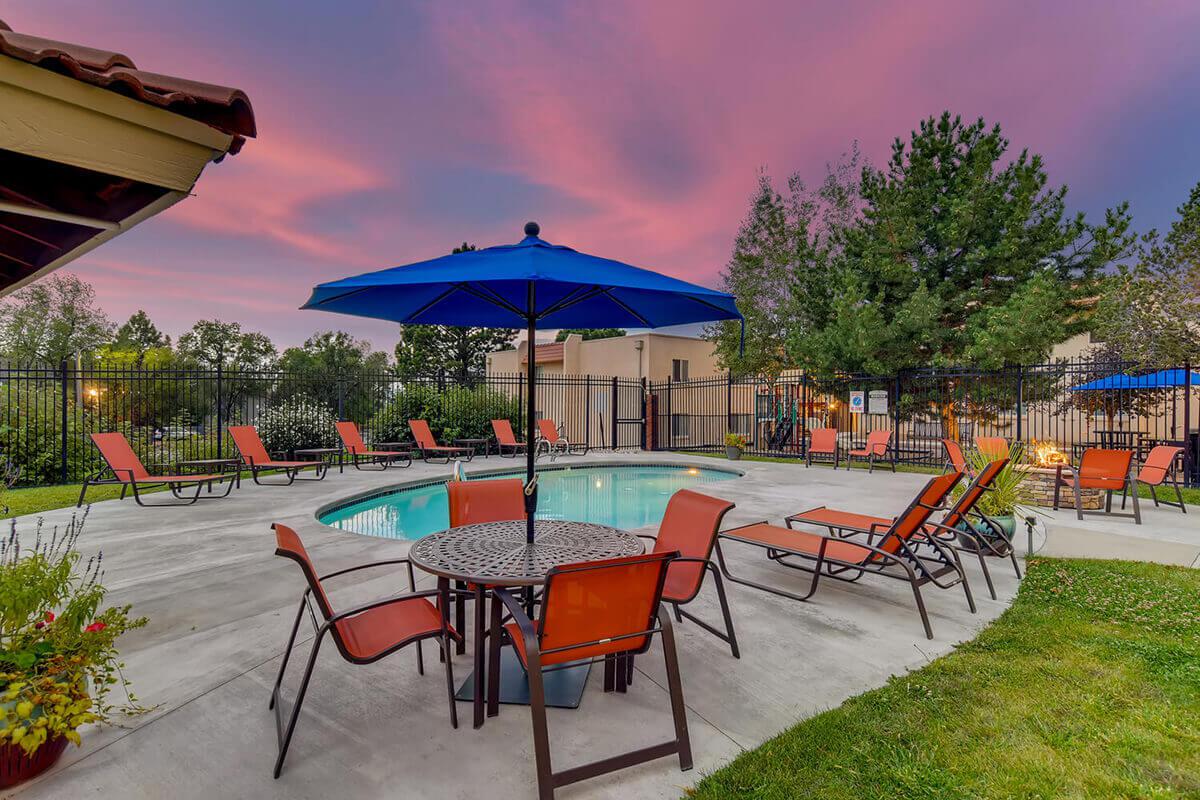 a couple of lawn chairs sitting on top of a table