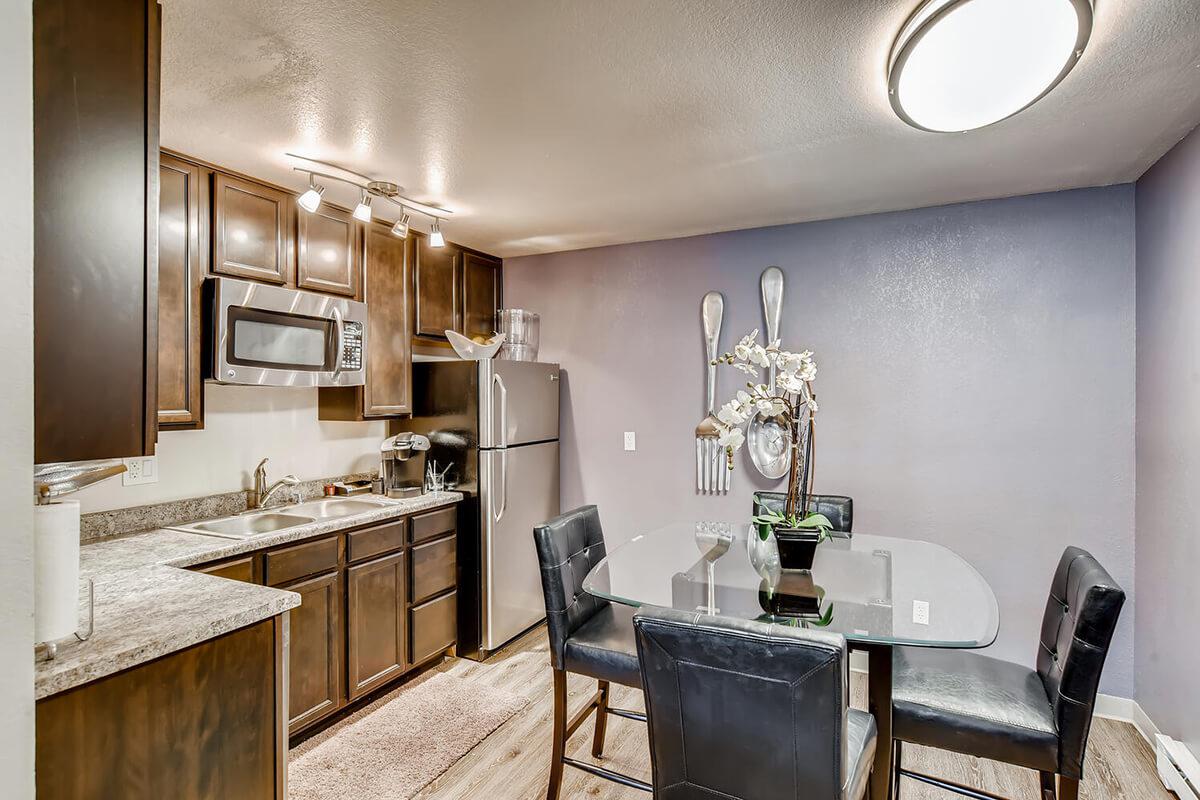 a kitchen with a table in a room