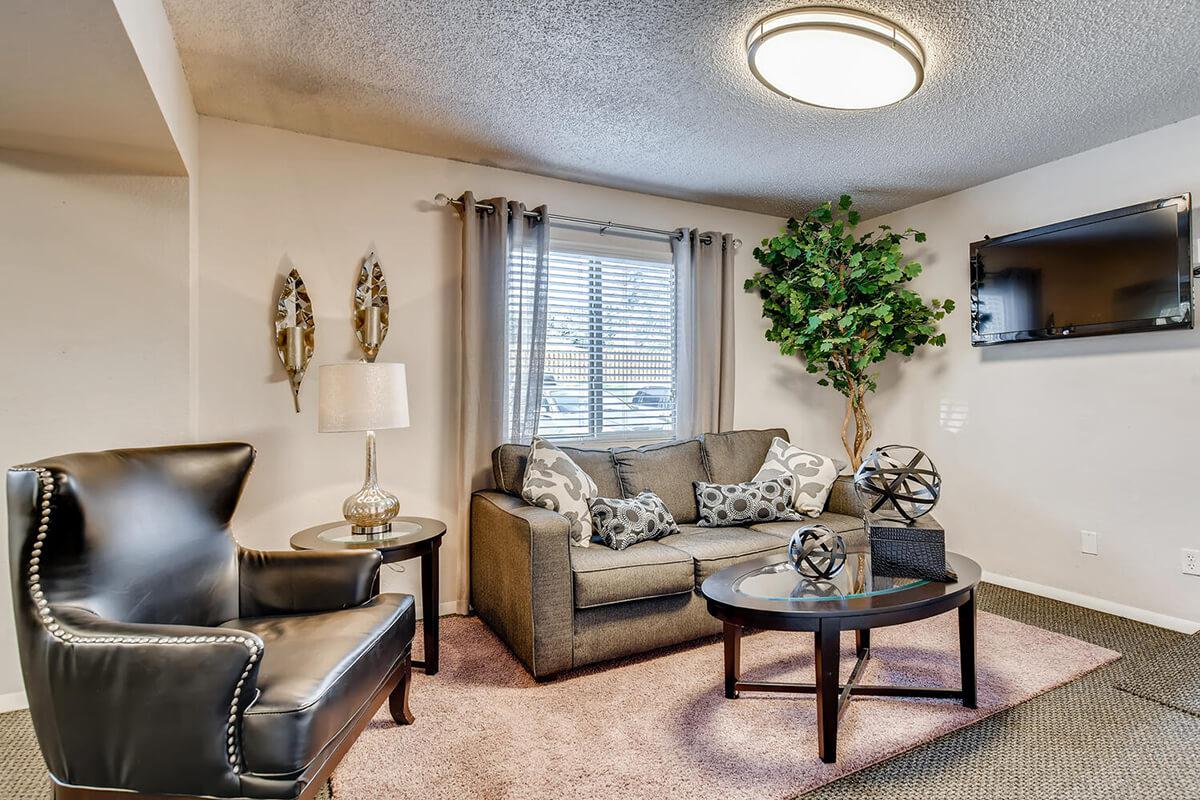 a living room filled with furniture and a fireplace