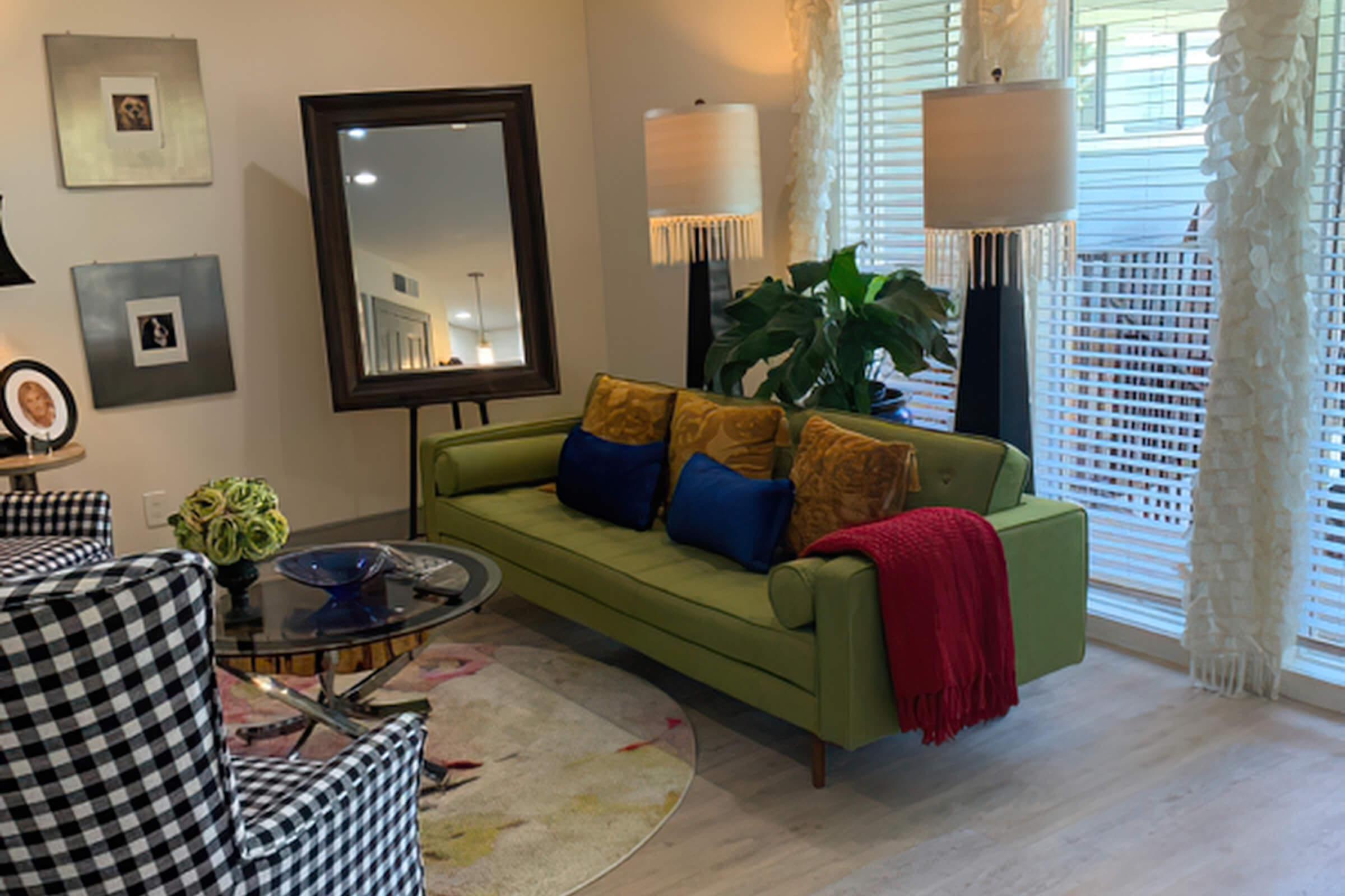 a living room filled with furniture and a tv