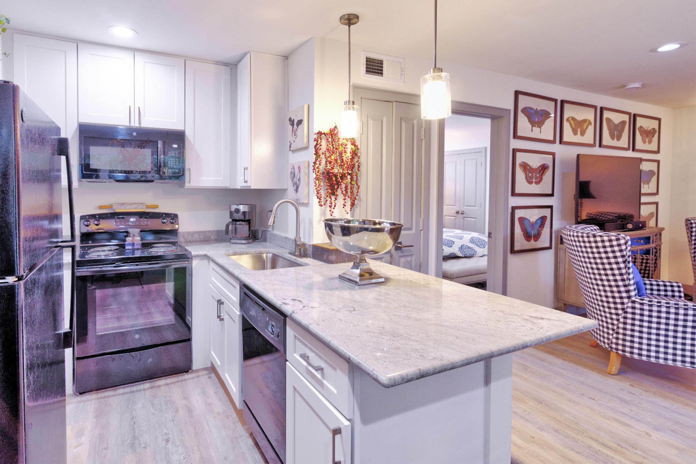 a kitchen with an island in the middle of a room