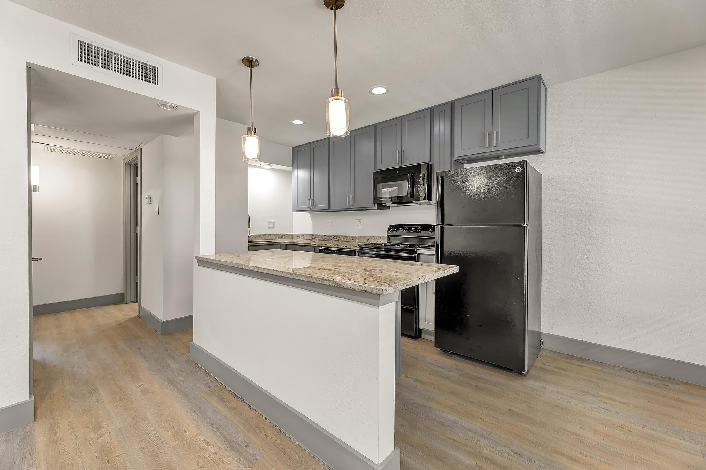 a kitchen with a building in the background