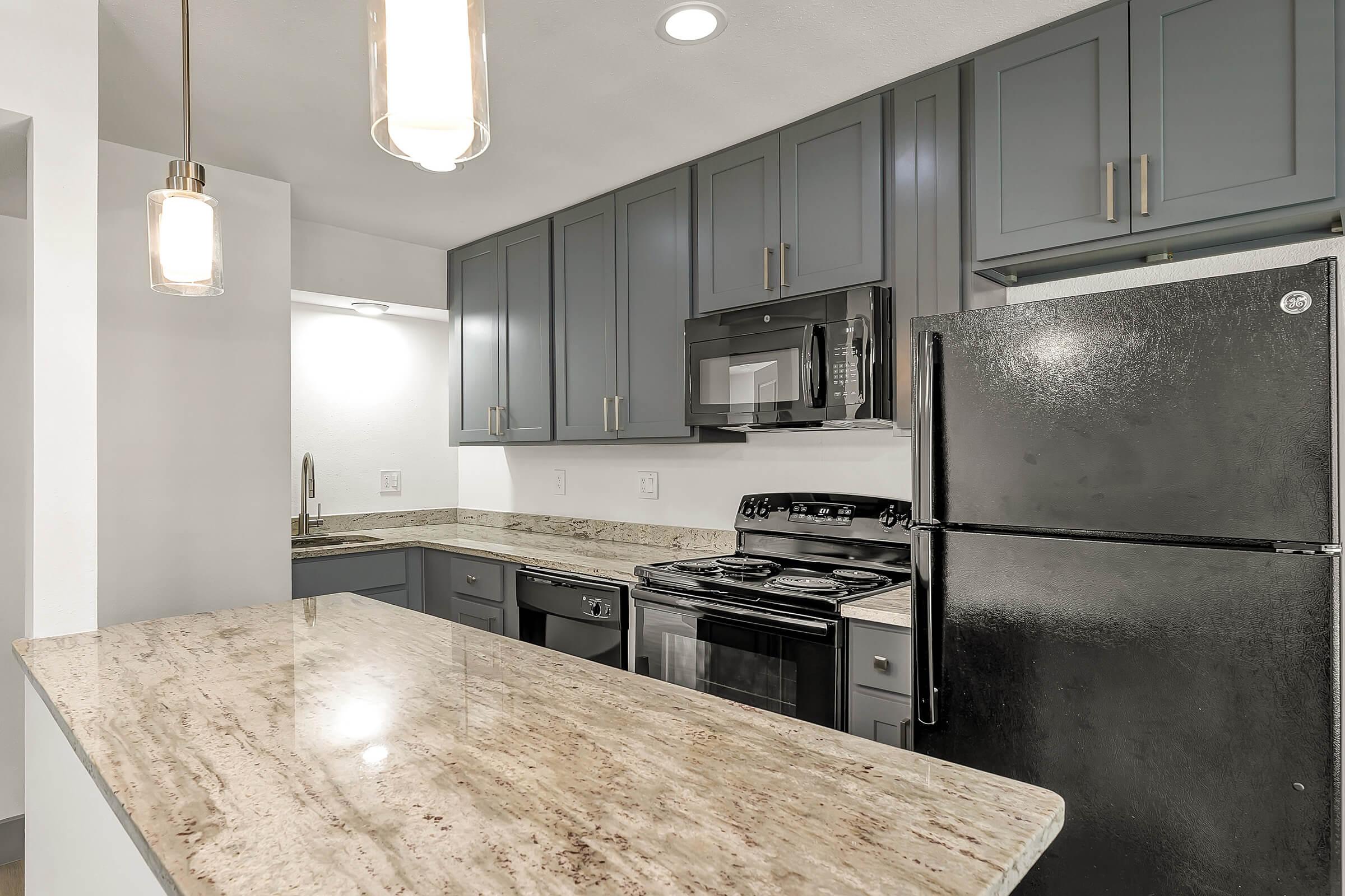 a large kitchen with stainless steel appliances