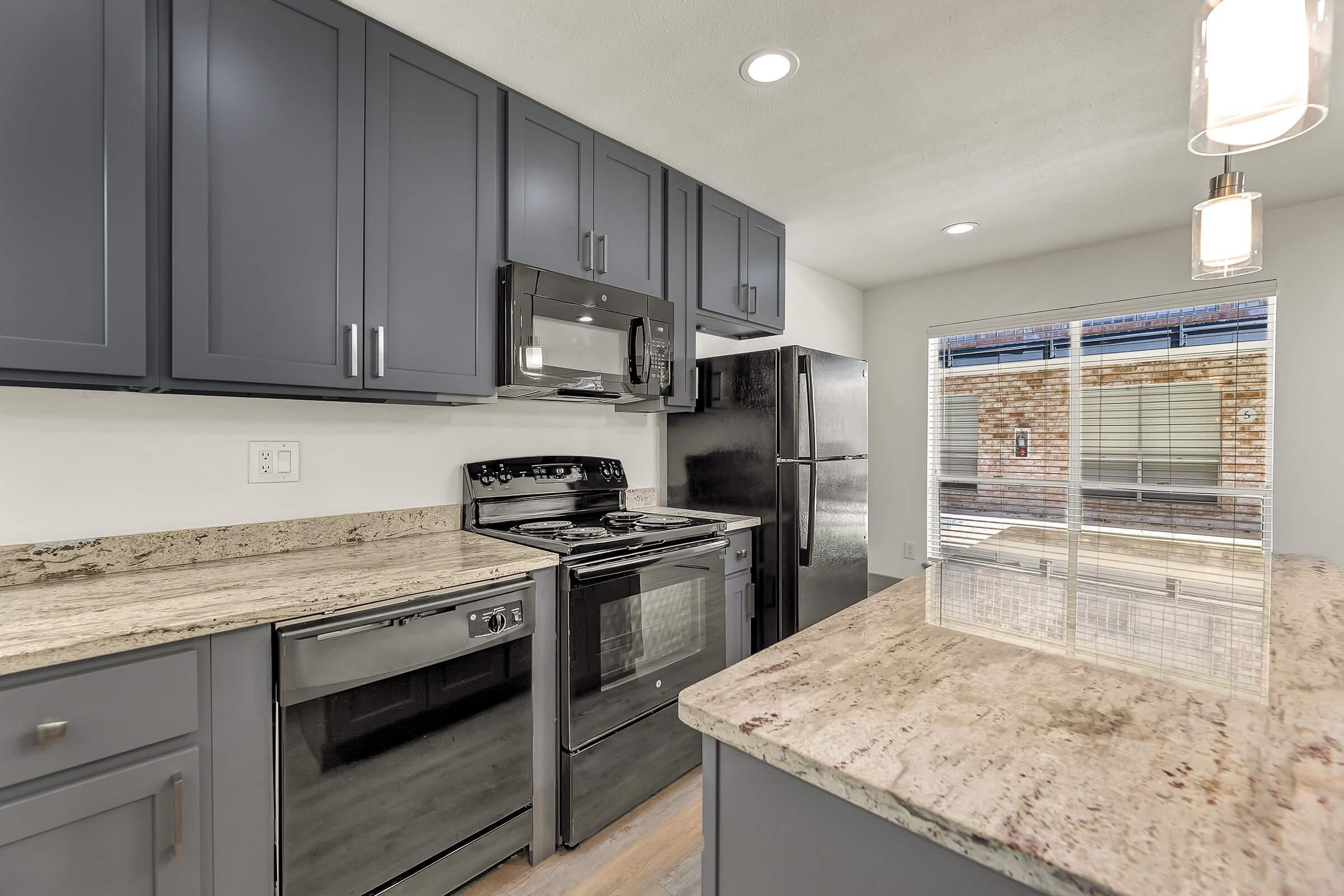 a large kitchen with stainless steel appliances