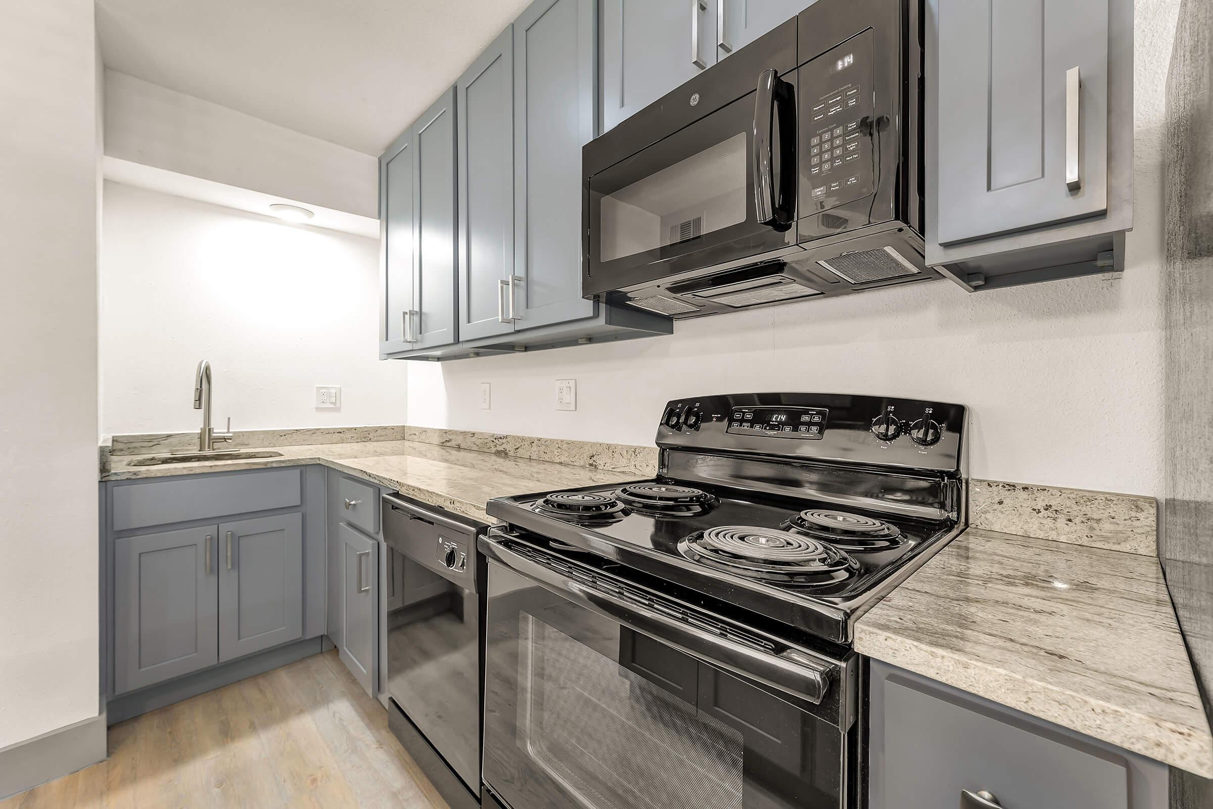 a kitchen with a stove and a sink