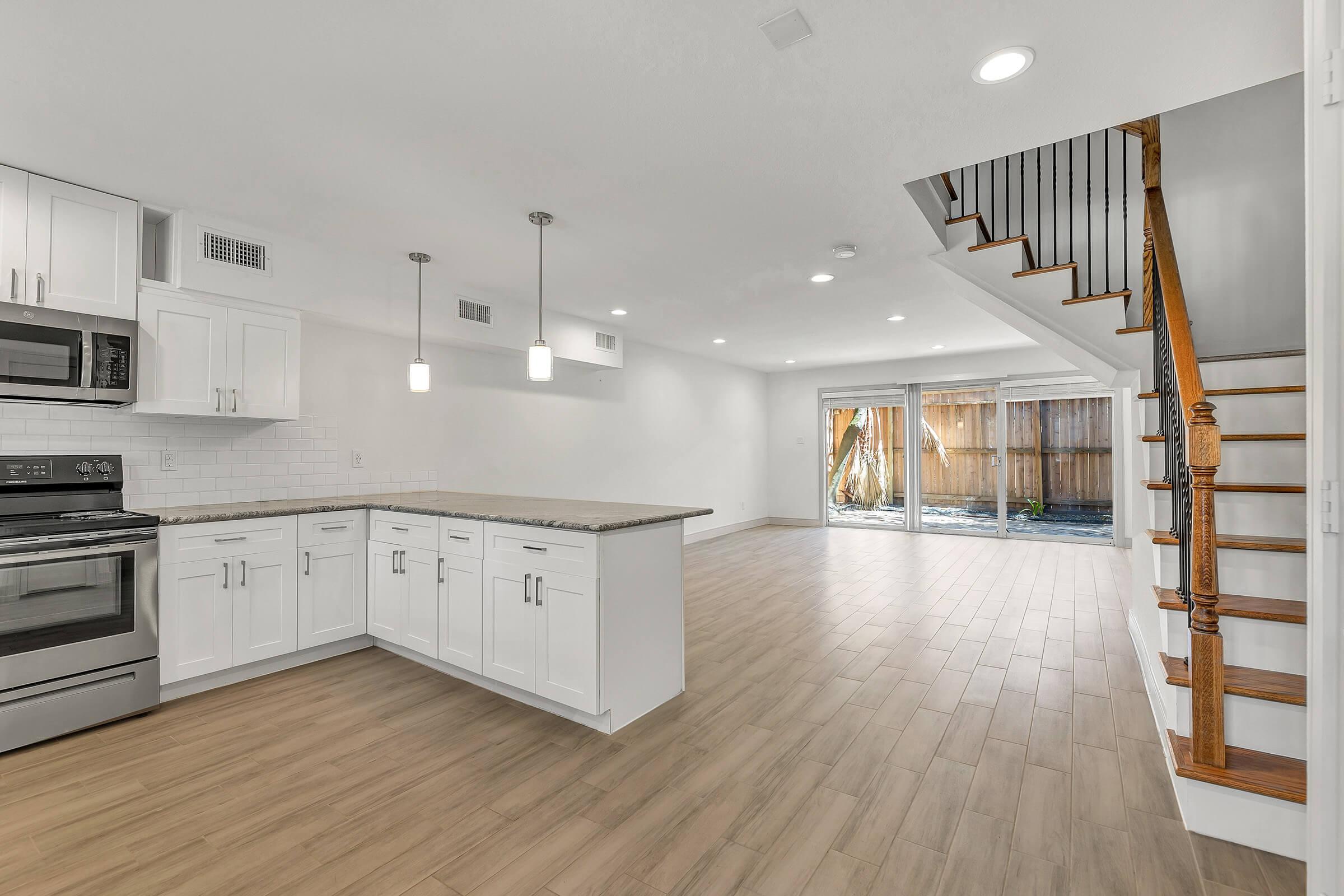 a kitchen with a wood floor