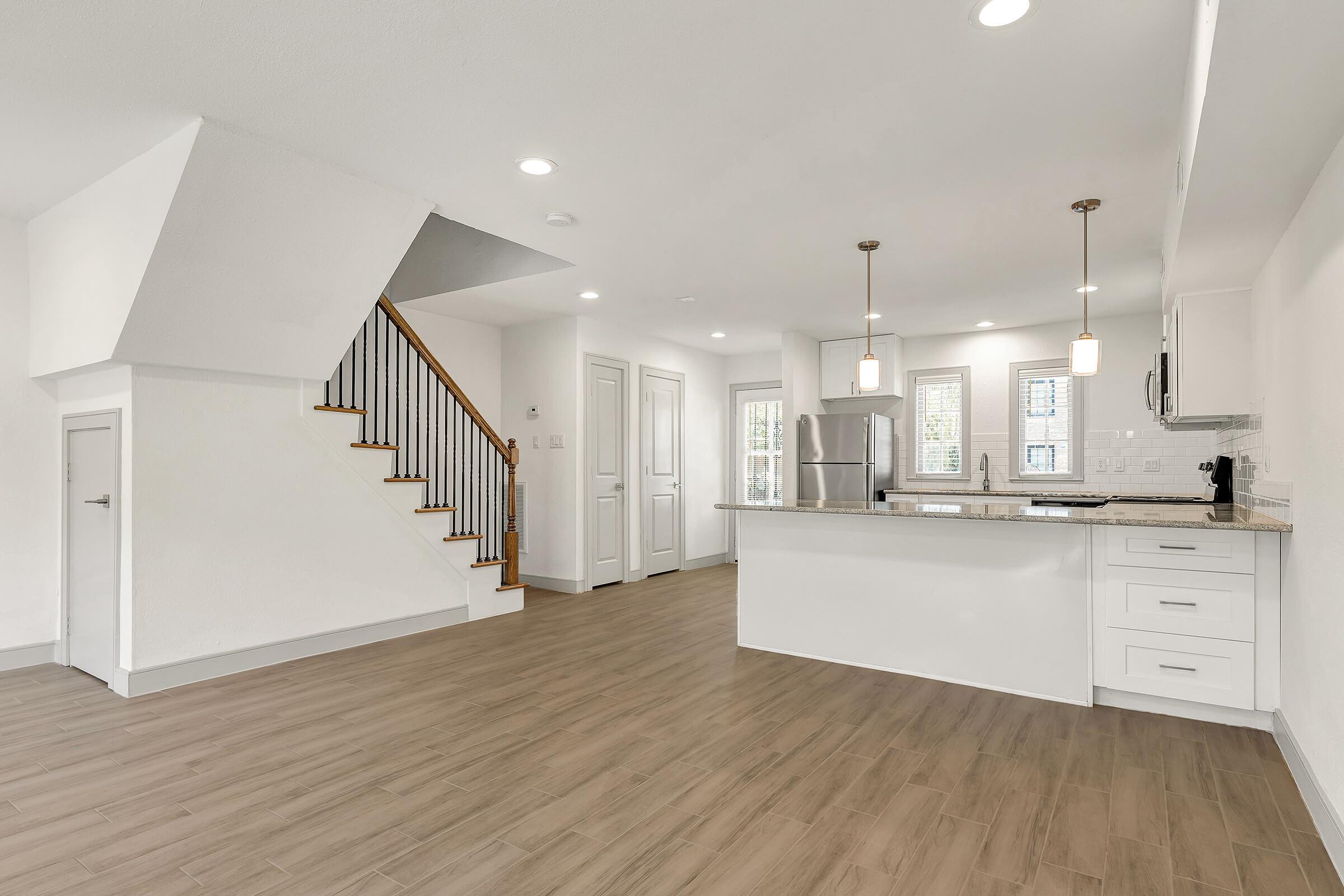 a kitchen with a wooden floor