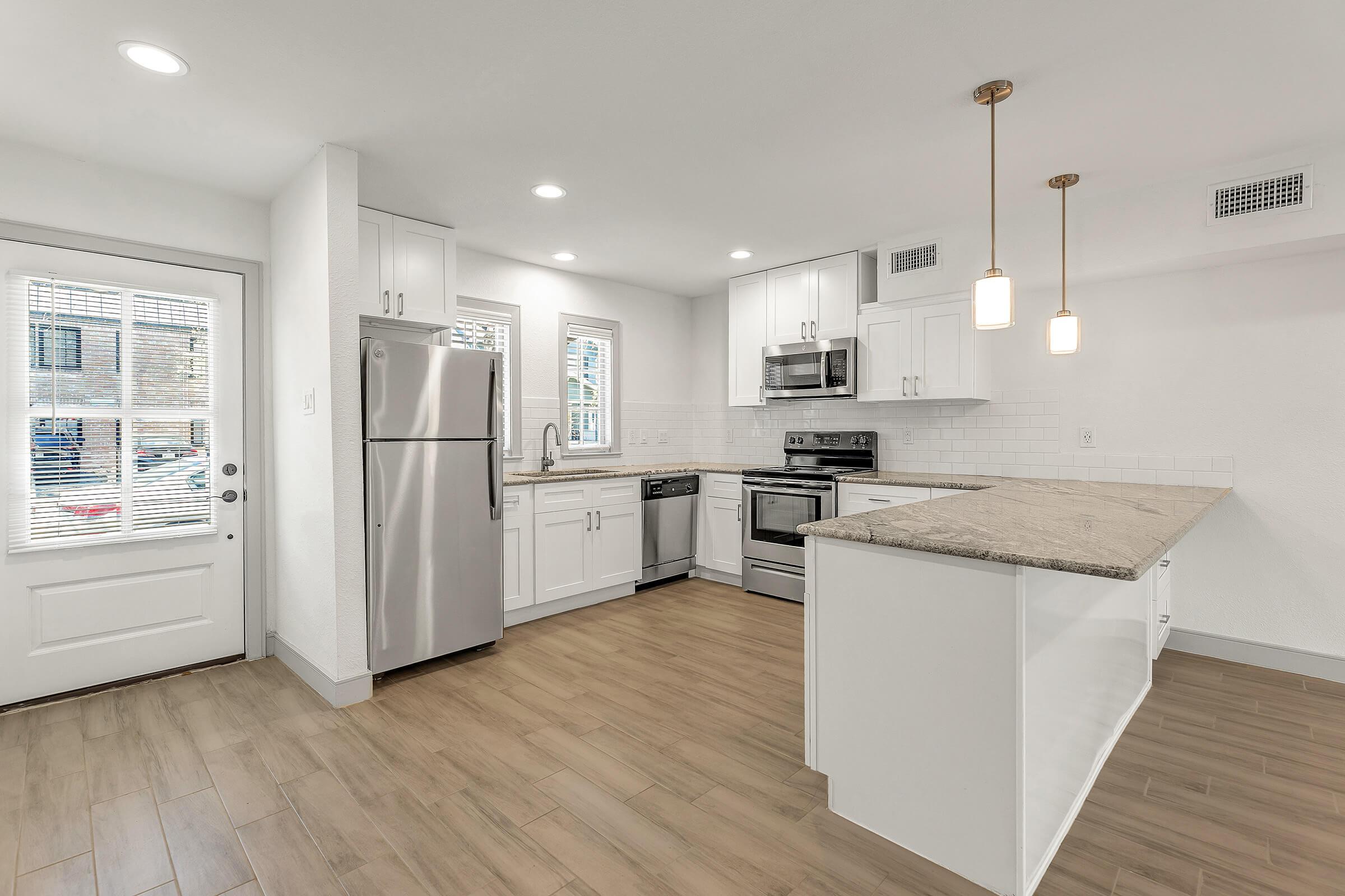 a kitchen with a building in the background