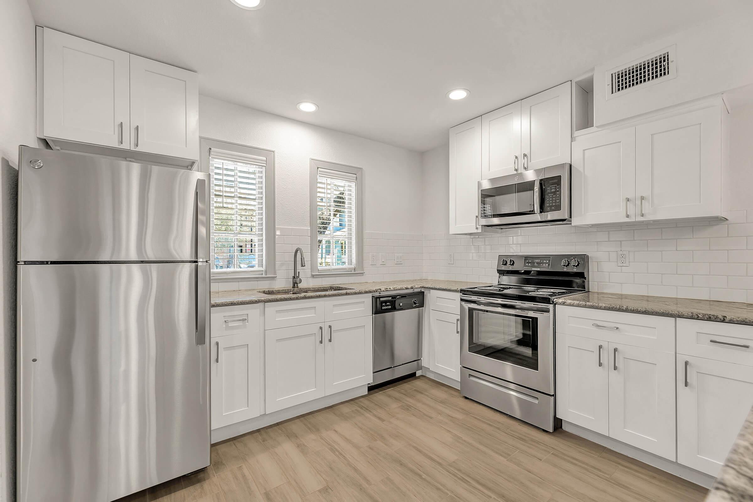 a stainless steel refrigerator in a kitchen