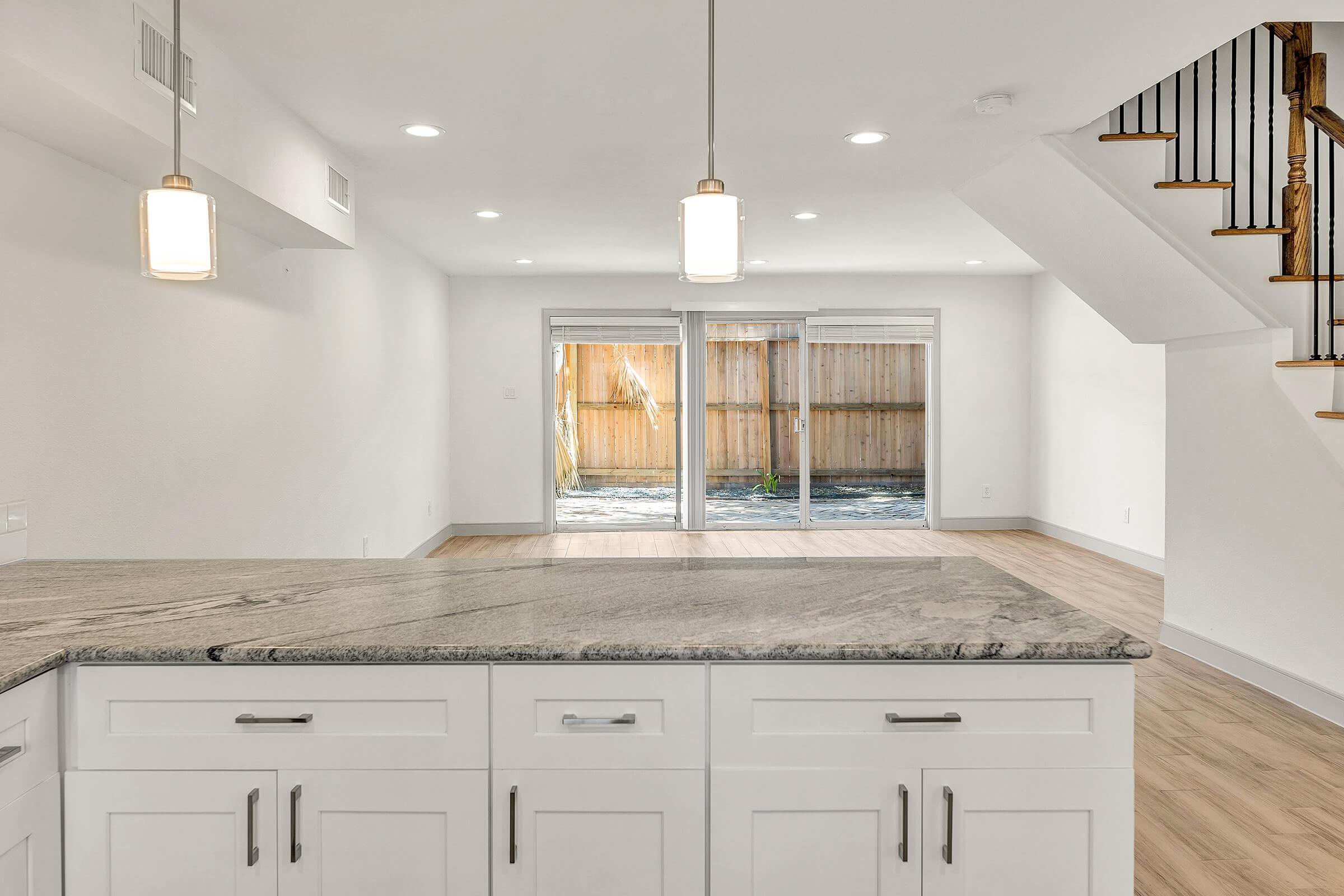 a kitchen with a sink and a mirror