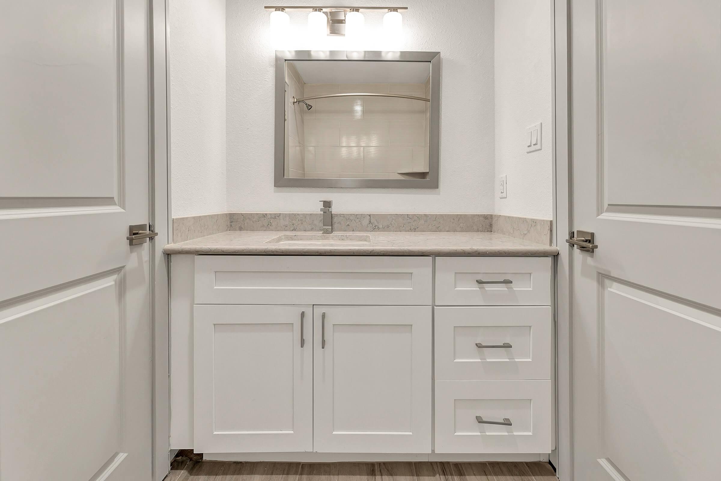 a kitchen with a sink and a refrigerator