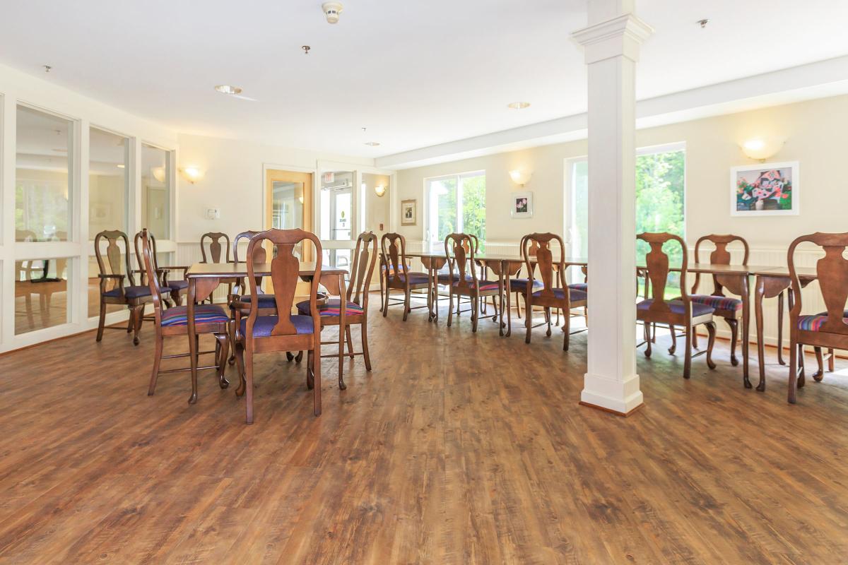 a living room filled with furniture on top of a wooden floor