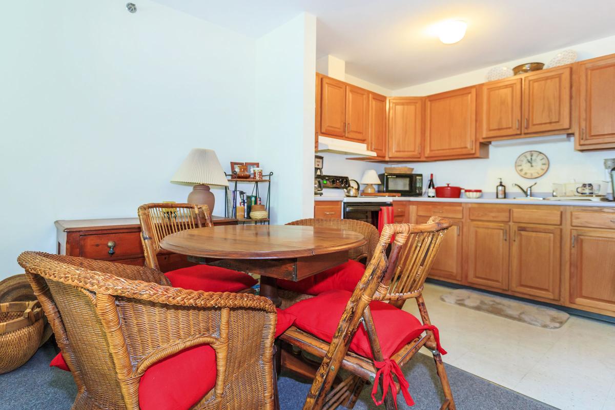 a kitchen filled with lots of furniture