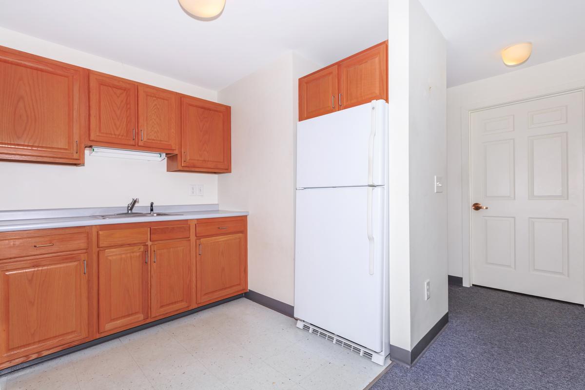 a kitchen with a wood floor