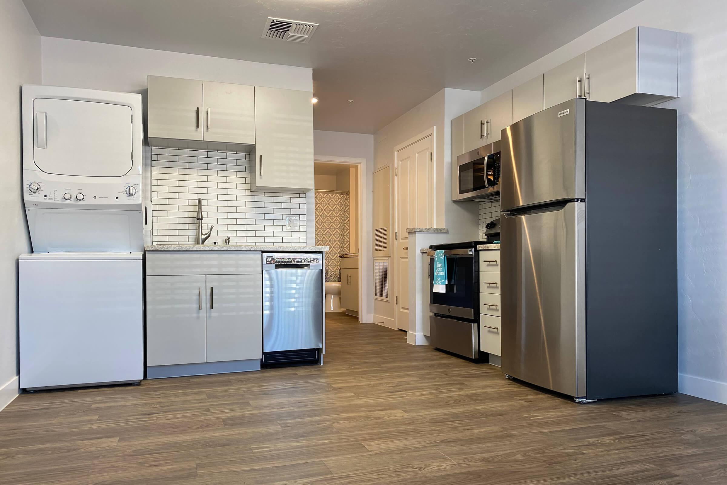 a stainless steel refrigerator in a kitchen