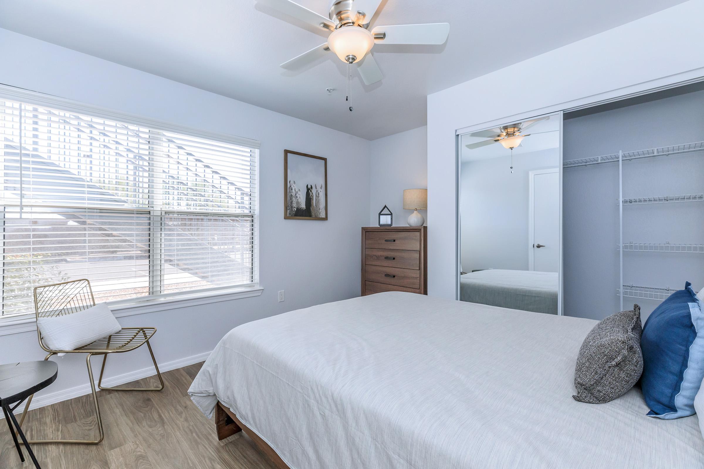 a bedroom with a bed in a room