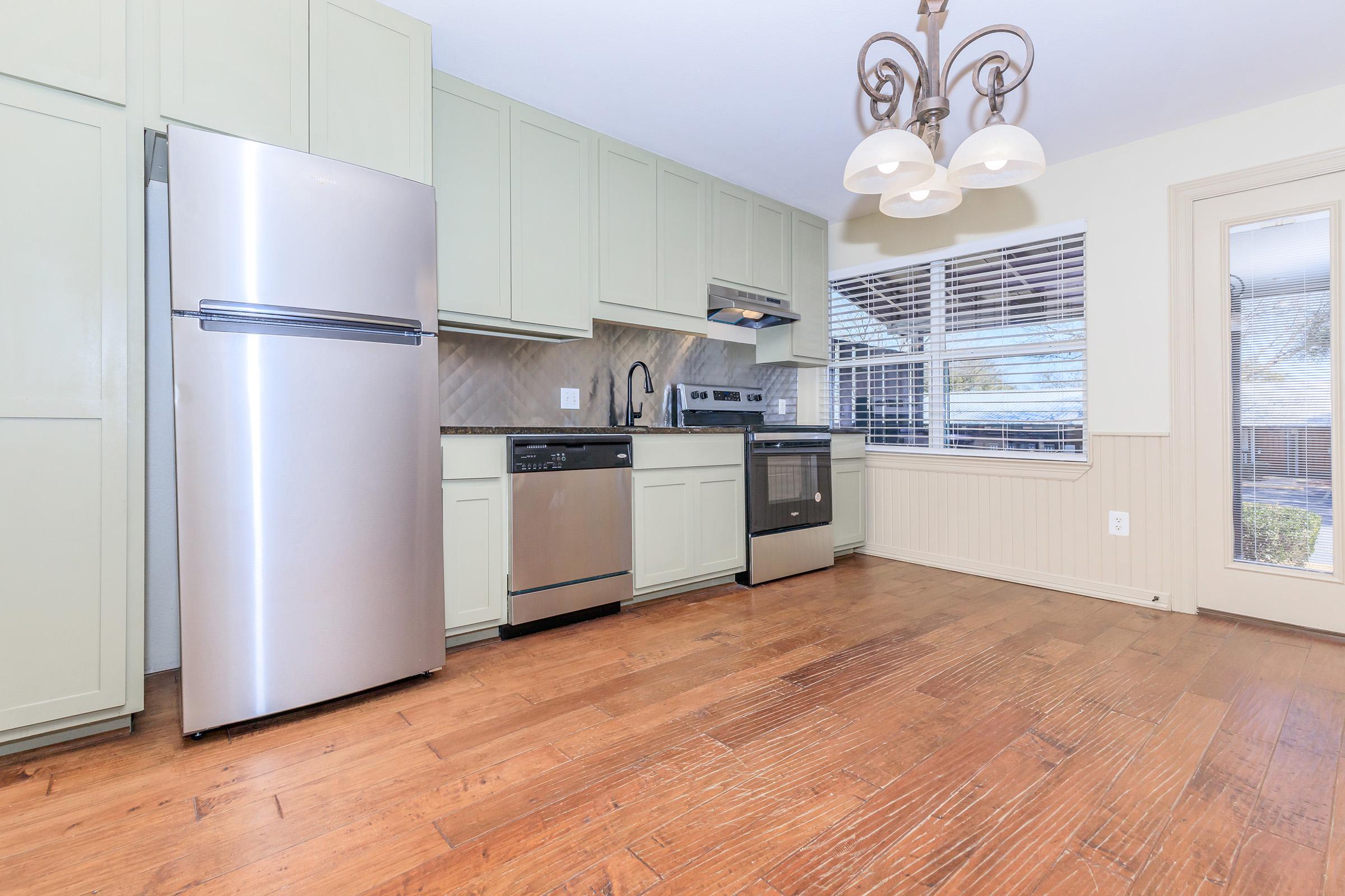 a stainless steel refrigerator in a kitchen