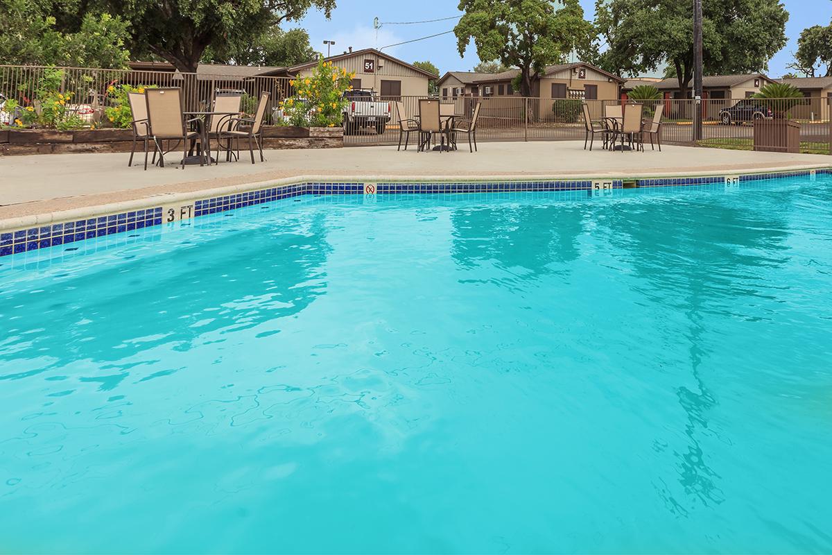 a pool next to a body of water