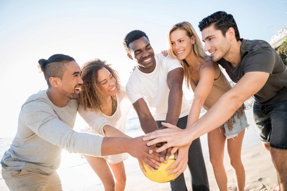 People playing volleyball at the beach iStock-505693486.jpg