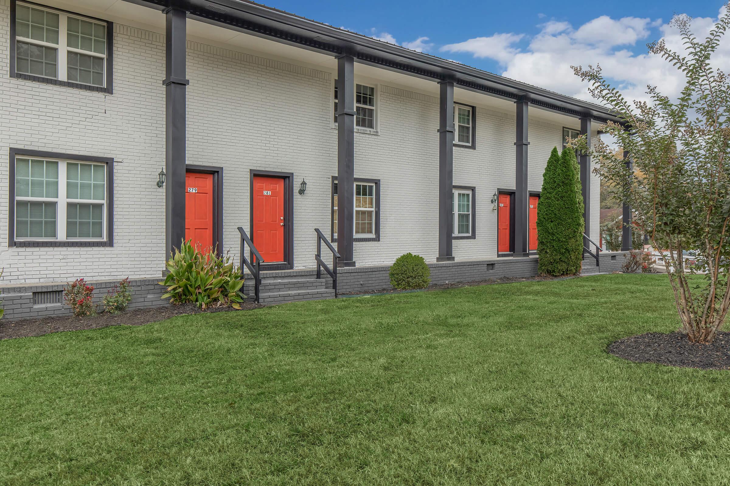 Community of Elements44 Townhomes landscape with bushes, trees, and the view of the 2 Bed 1.5 Bath Townhomes 