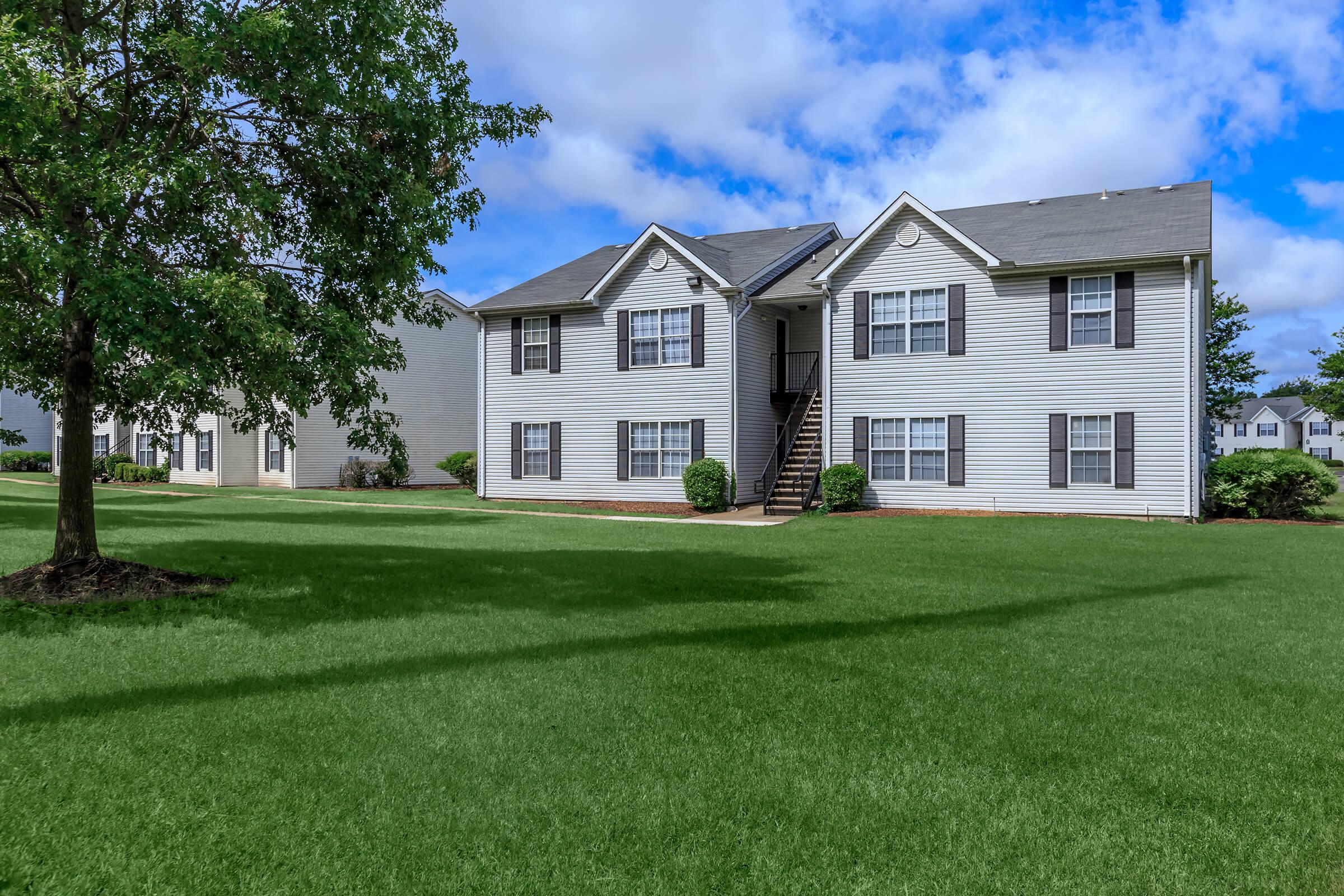 a large lawn in front of a house