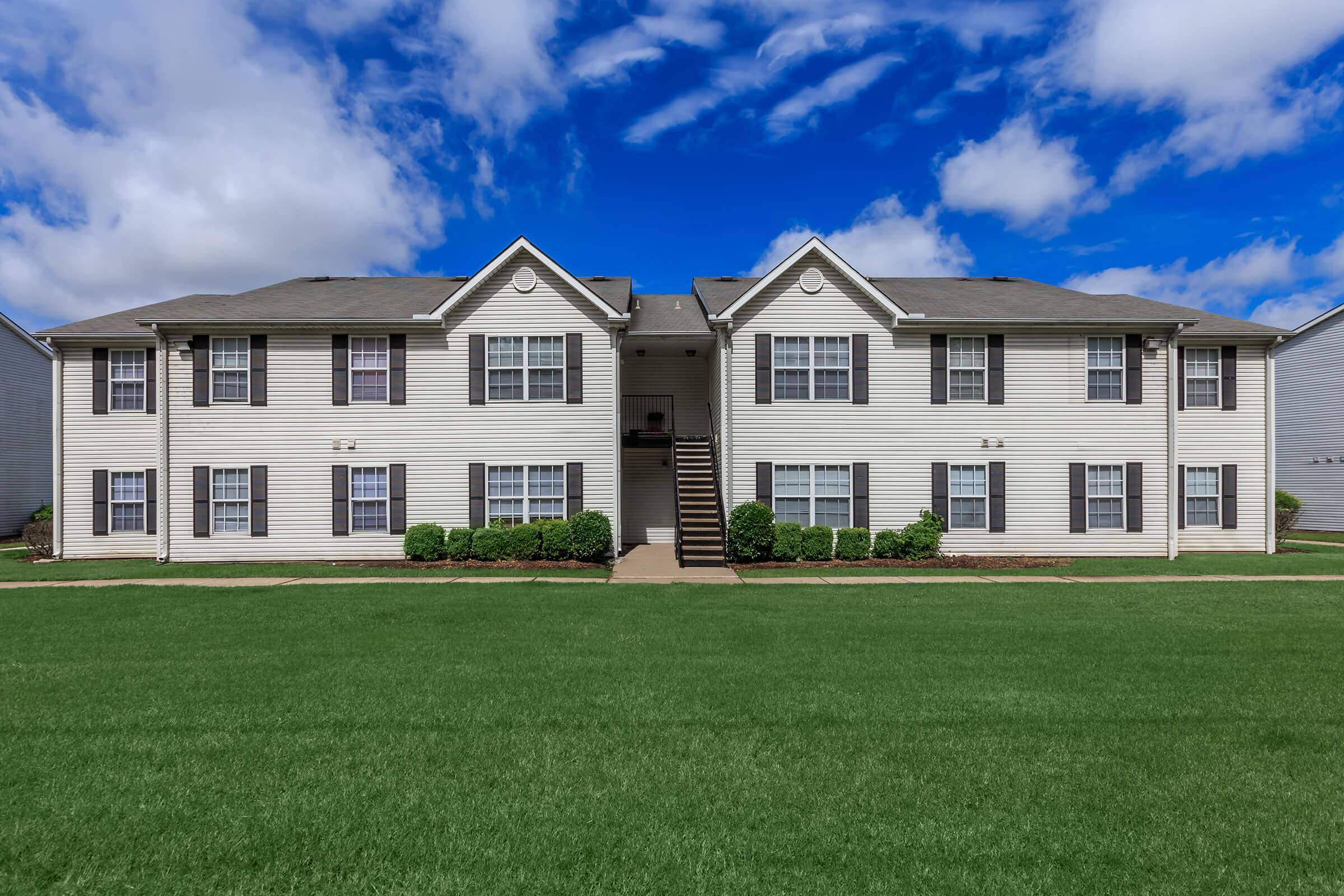 a large lawn in front of a house