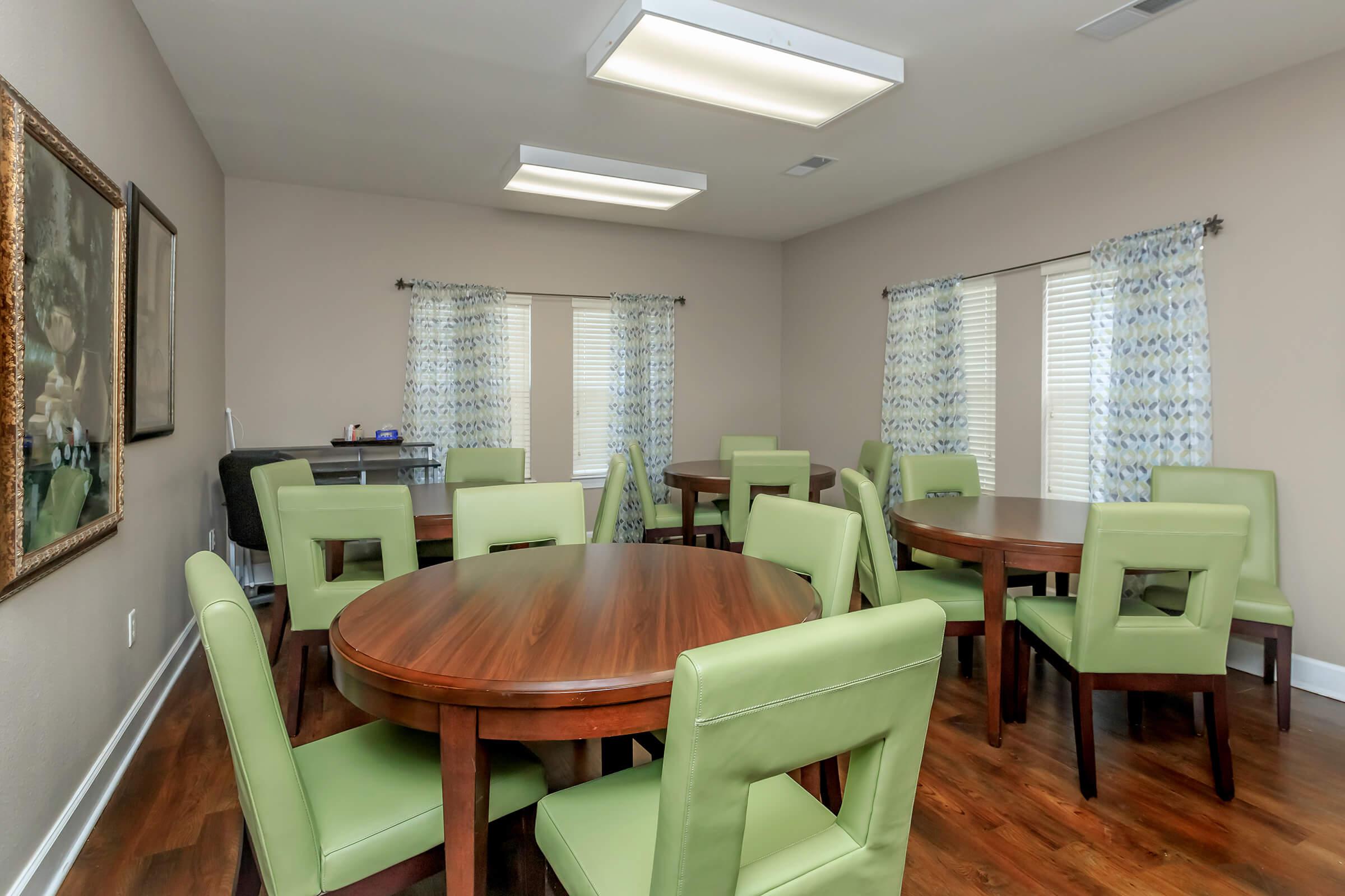 a living room filled with furniture and a table