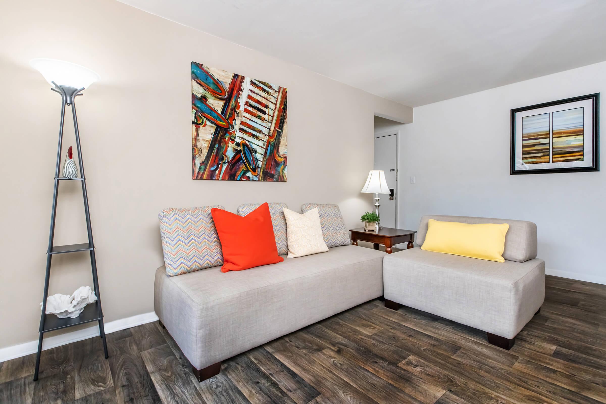 a living room filled with furniture and a bed