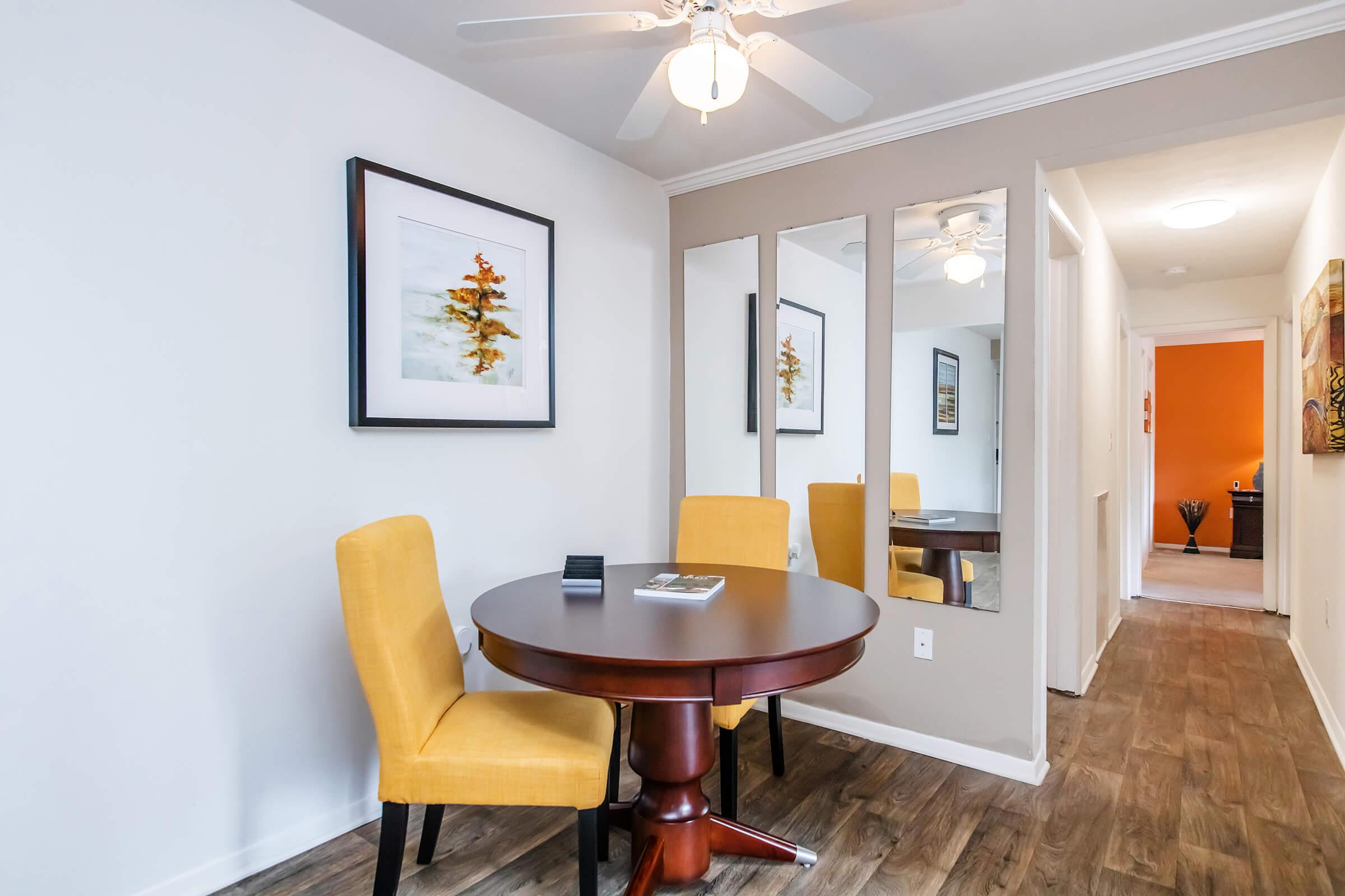 a room filled with furniture and a large mirror