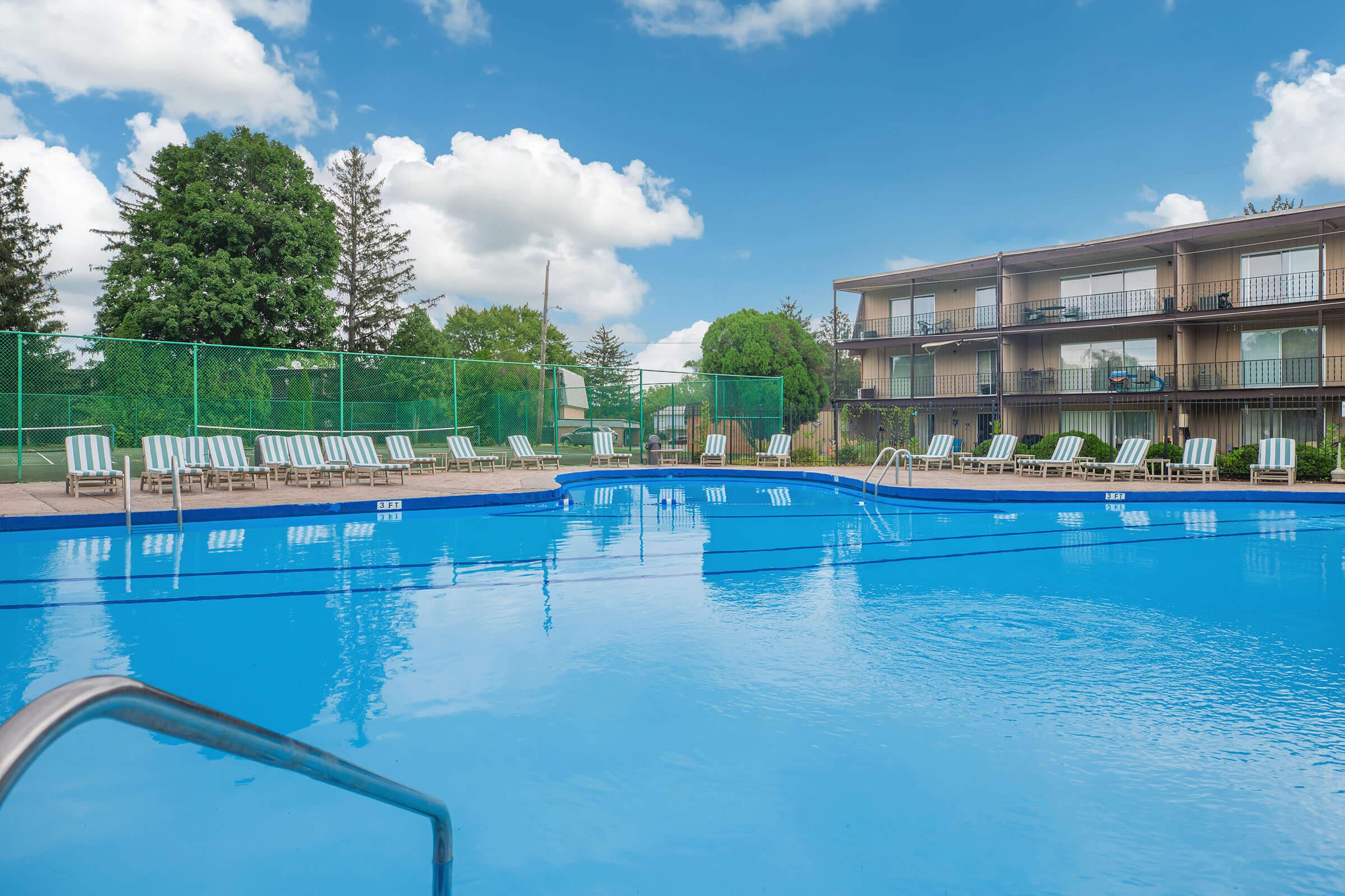 Outdoor pool with clear blue water at Homewood Manor Apartments in Moline, IL