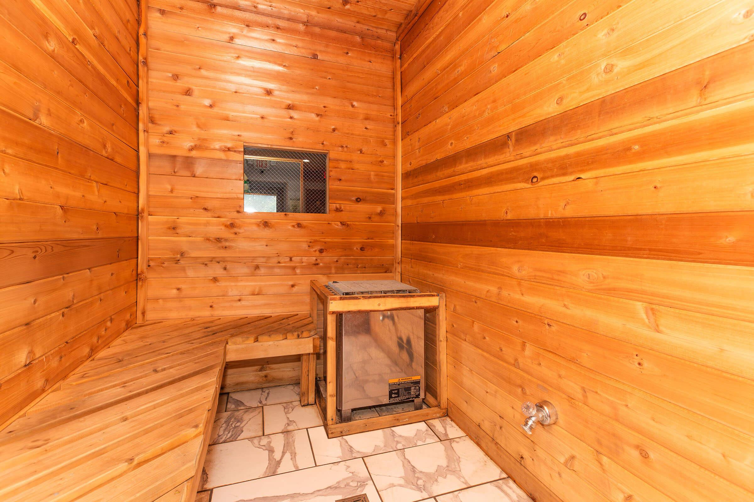 Wooden sauna with seating at Homewood Manor Apartments in Moline, IL