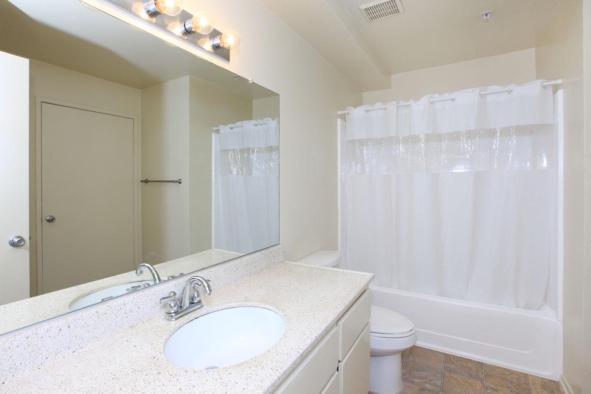 Bathroom with a white shower curtain