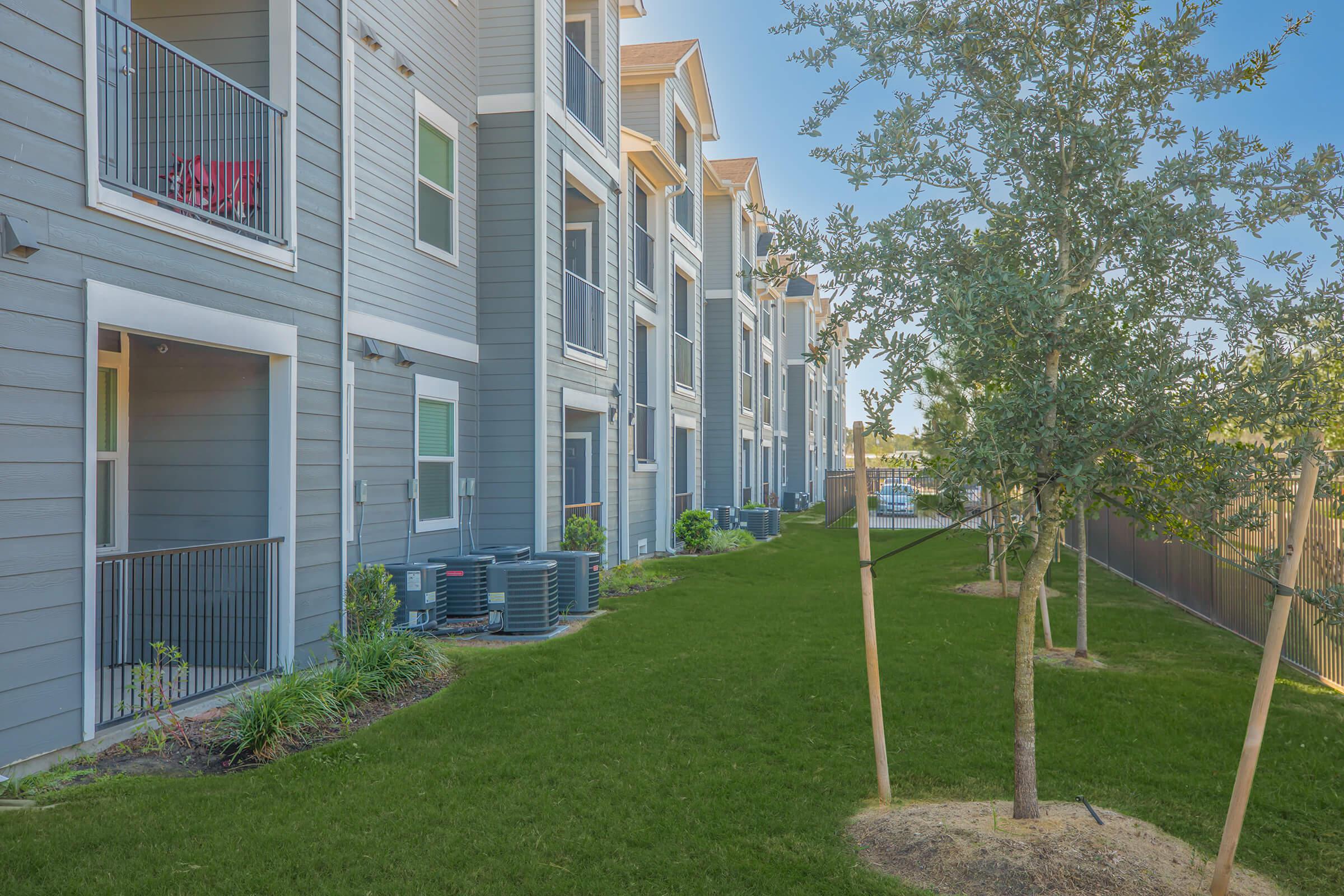 a tall building in a grassy yard