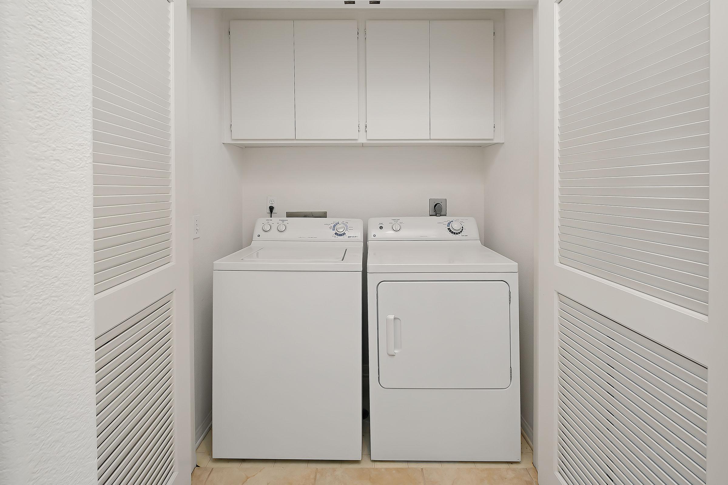 a white refrigerator freezer sitting in a room