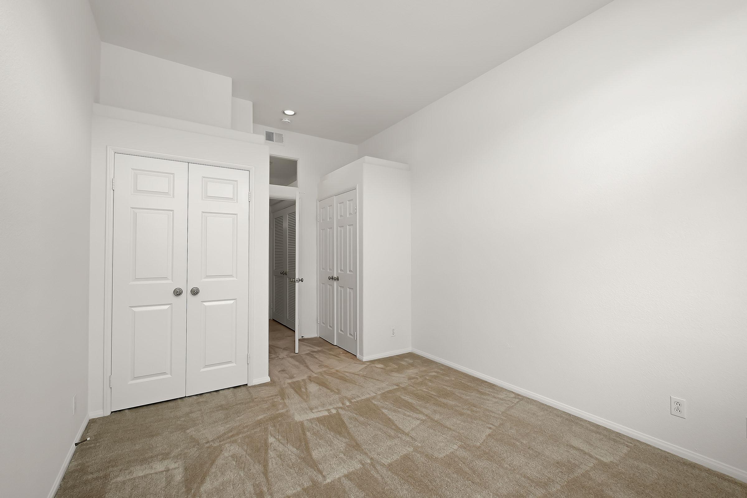 a white refrigerator freezer sitting in a room