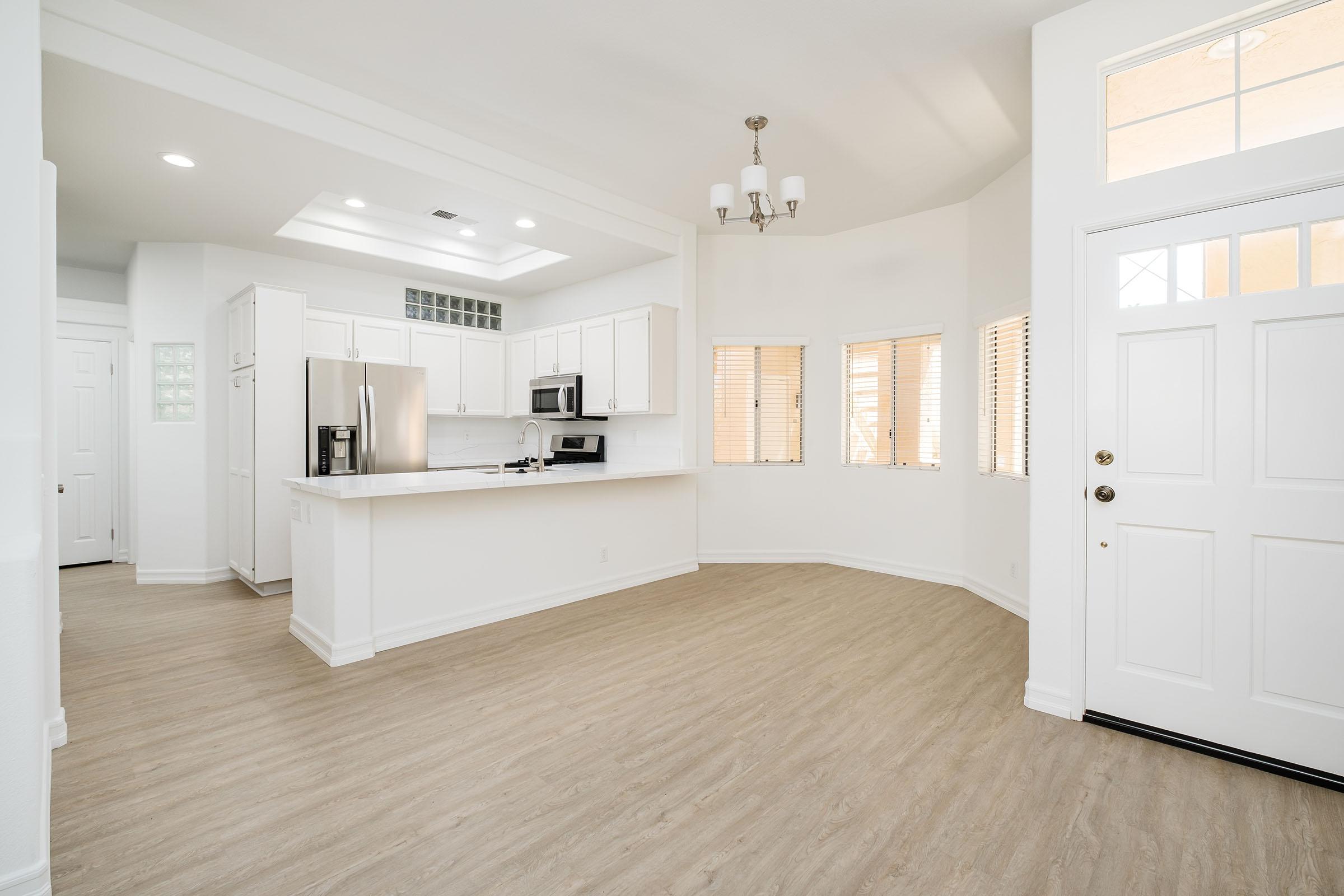 a kitchen with a wooden floor