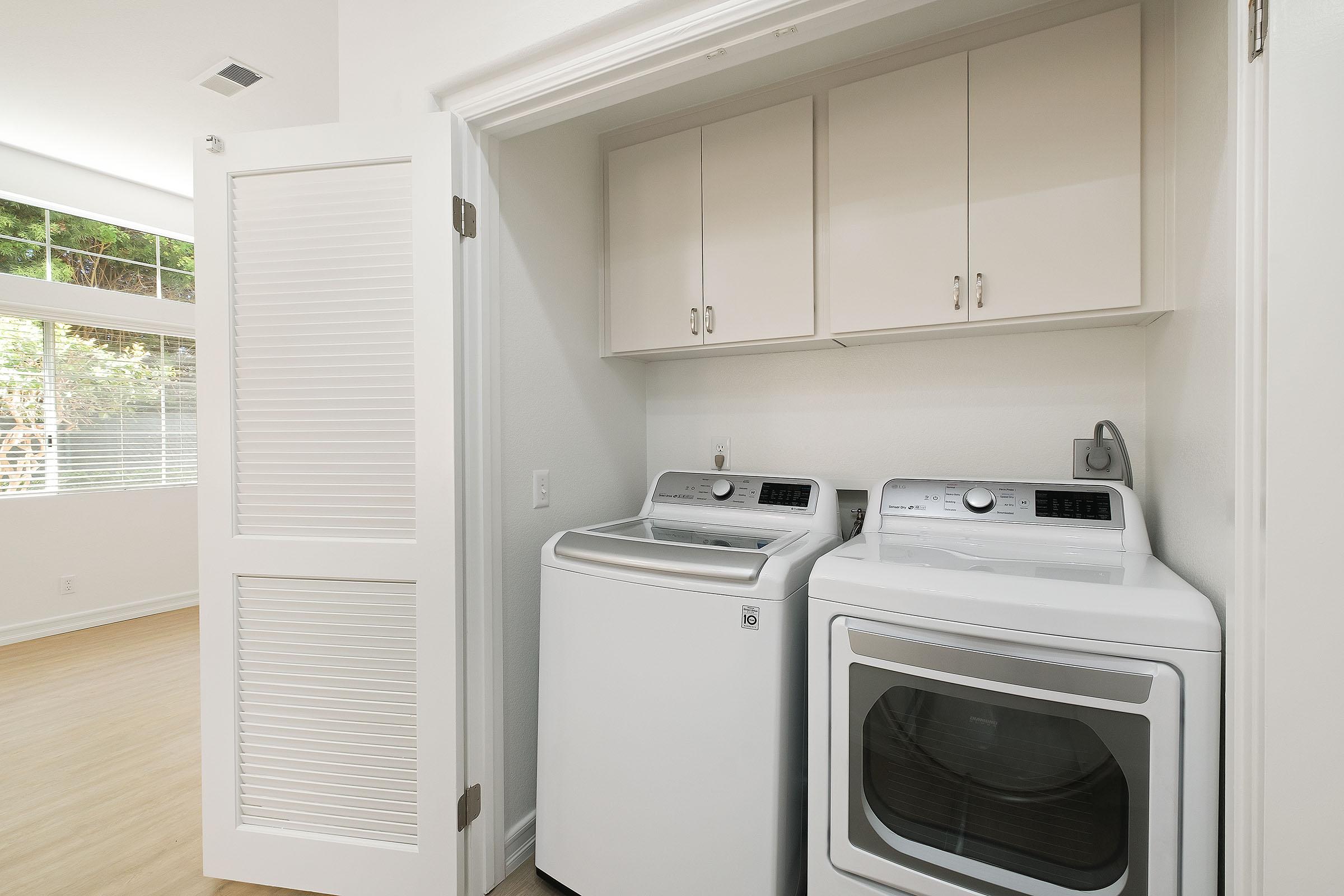 a microwave oven sitting on top of a refrigerator