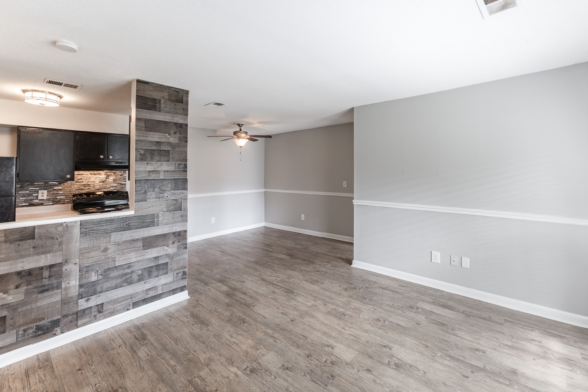 a kitchen with a sink and a mirror