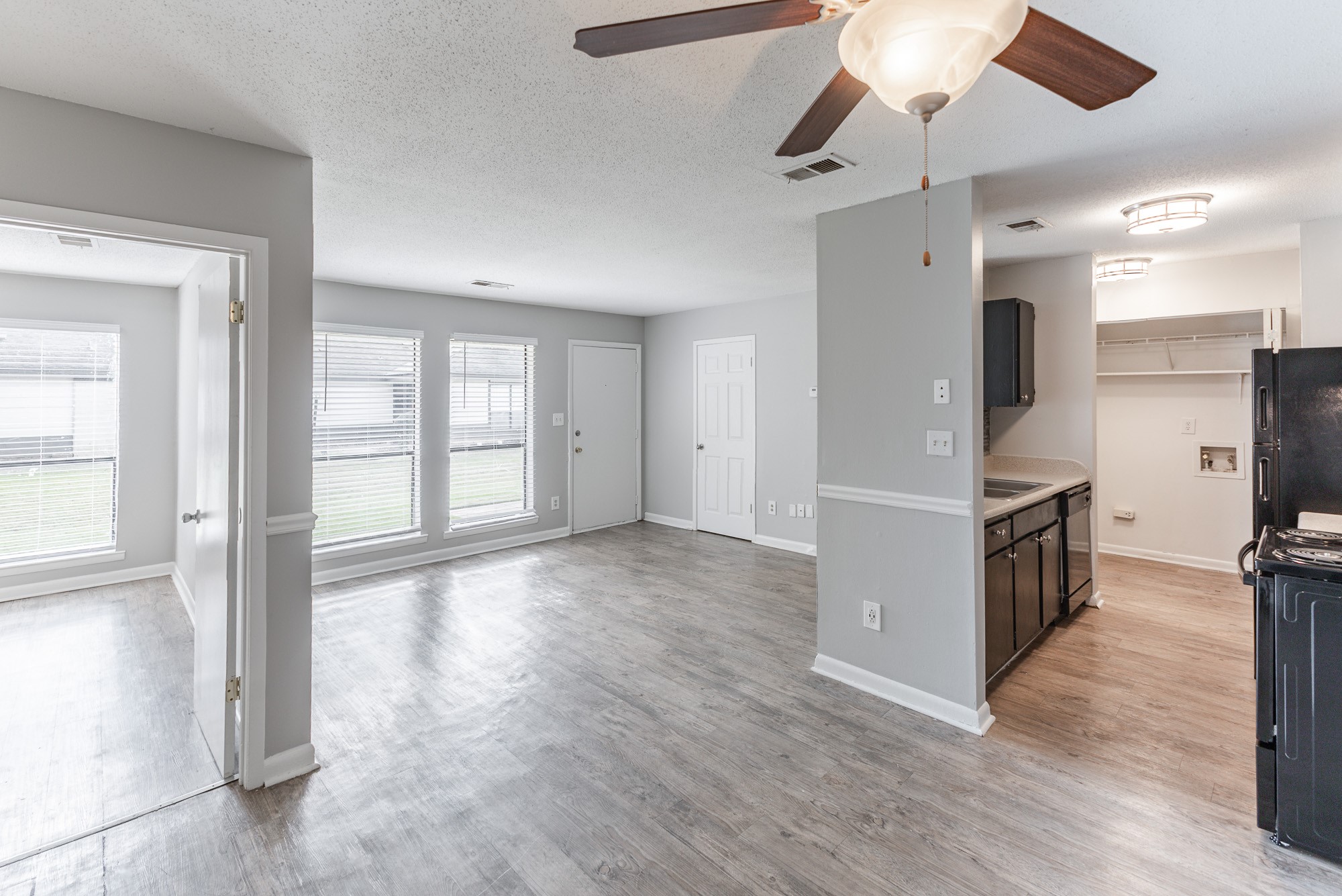 a room filled with furniture and a large window