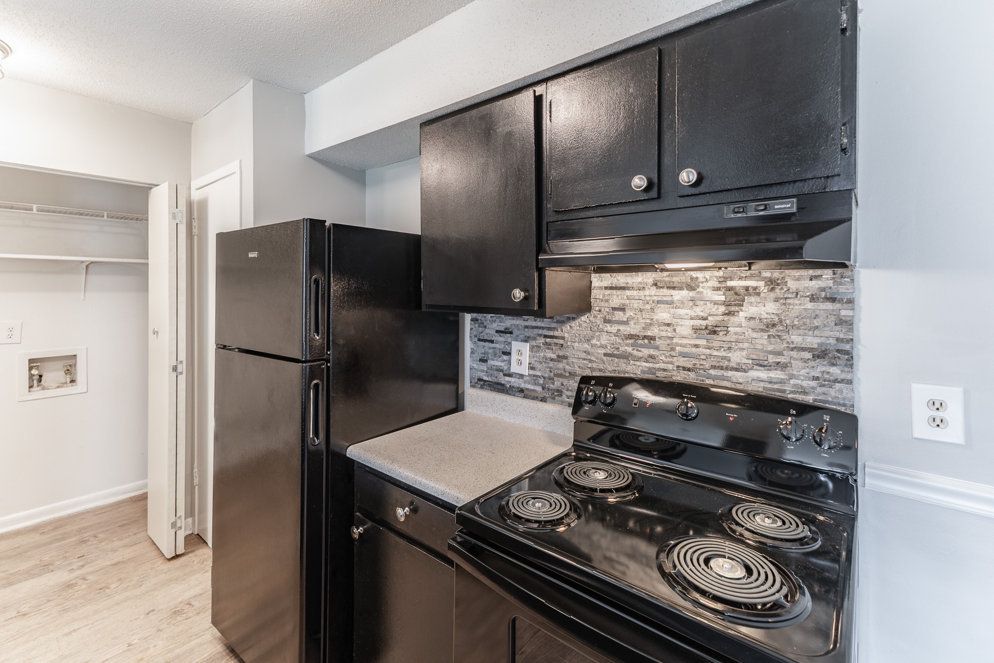 a large kitchen with stainless steel appliances