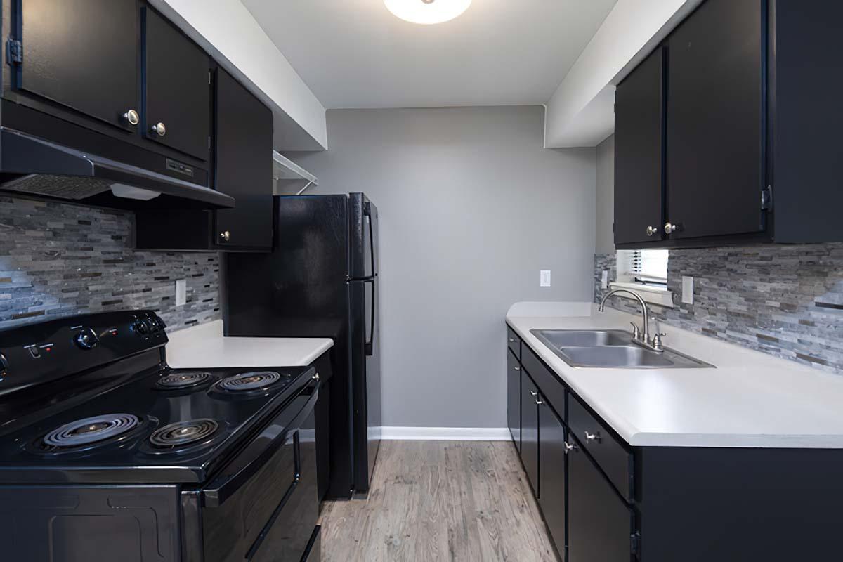 a kitchen with a stove and a sink