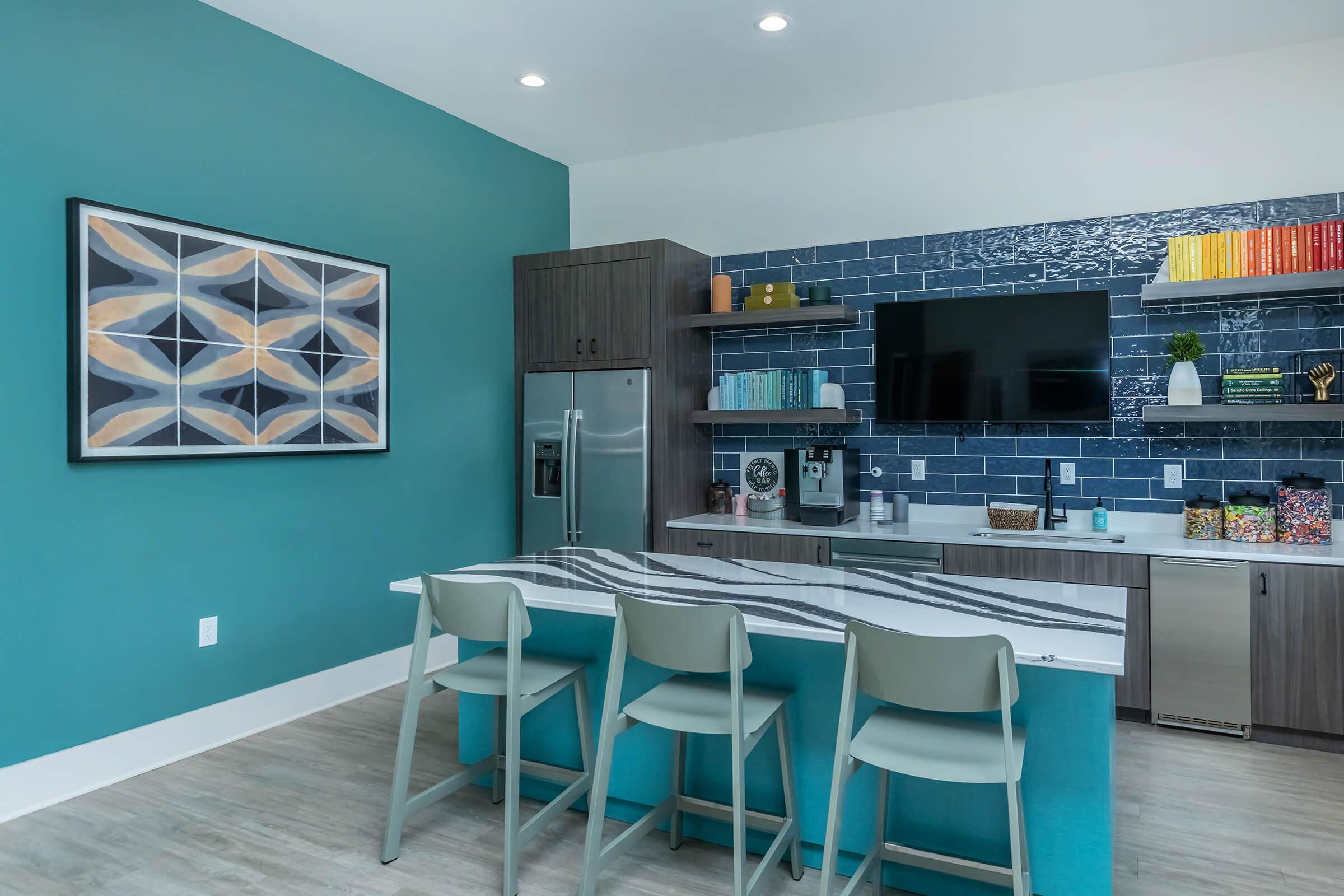 a kitchen with a blue chair