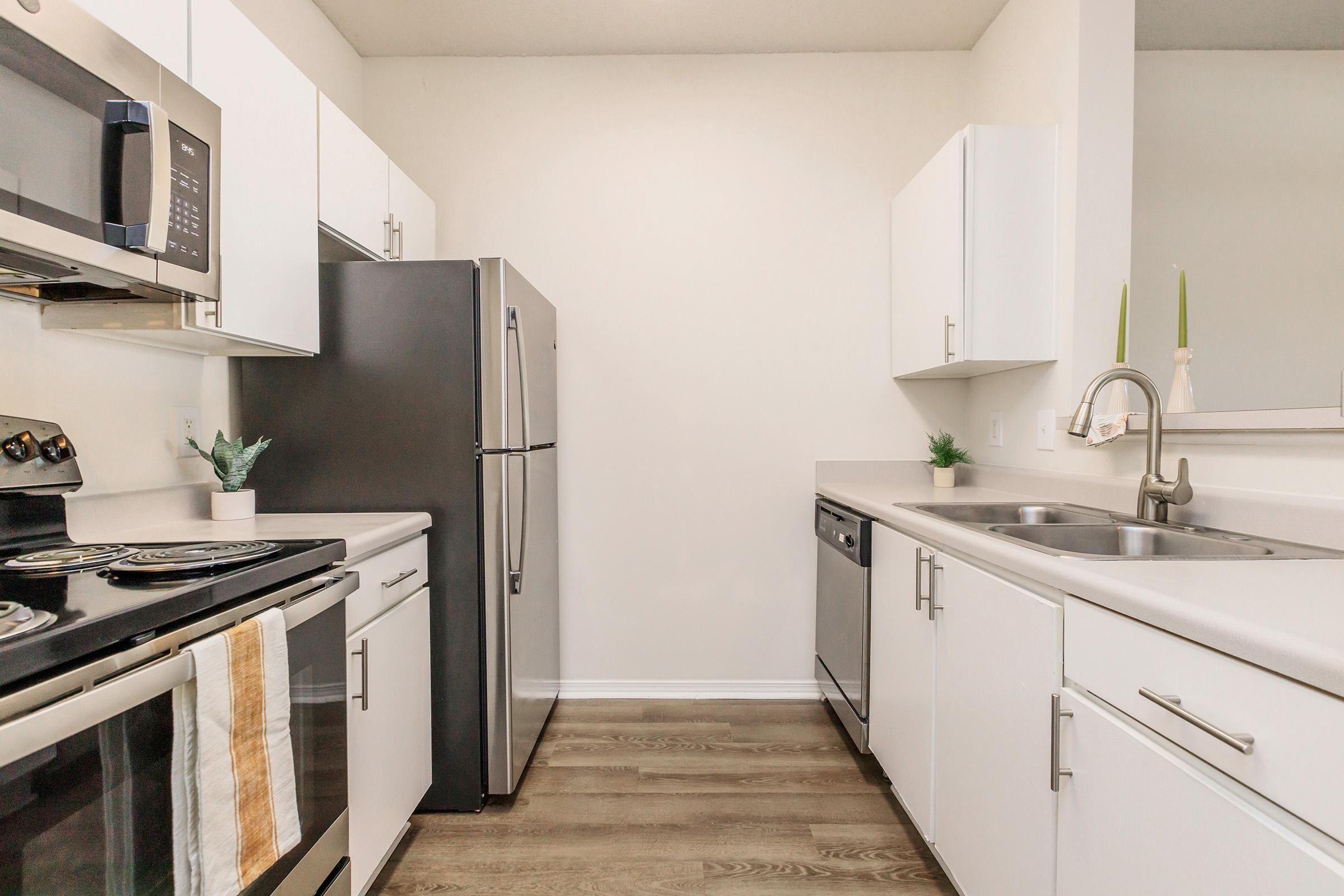 a kitchen with a stove and a sink